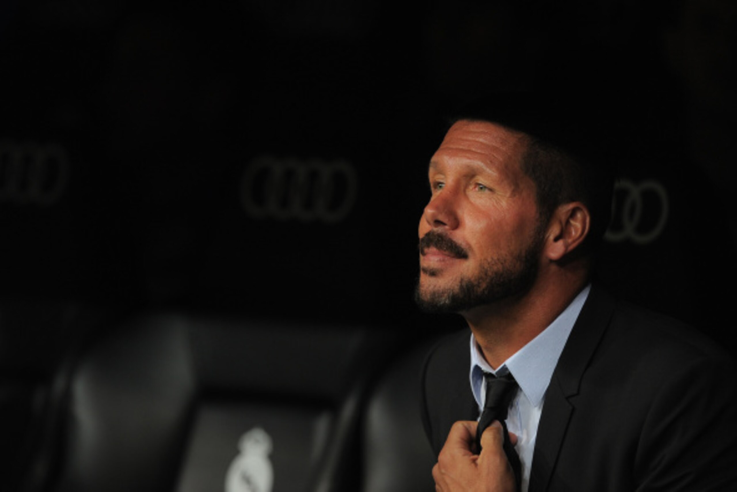 MADRID, SPAIN - AUGUST 19:  Head coach Diego Simeone of Club Atletico de Madrid looks on during the Supercopa first leg match between Real Madrid and Club Atletico de Madrid     at Estadio Santiago Bernabeu on August 19, 2014 in Madrid, Spain.  (Photo by 