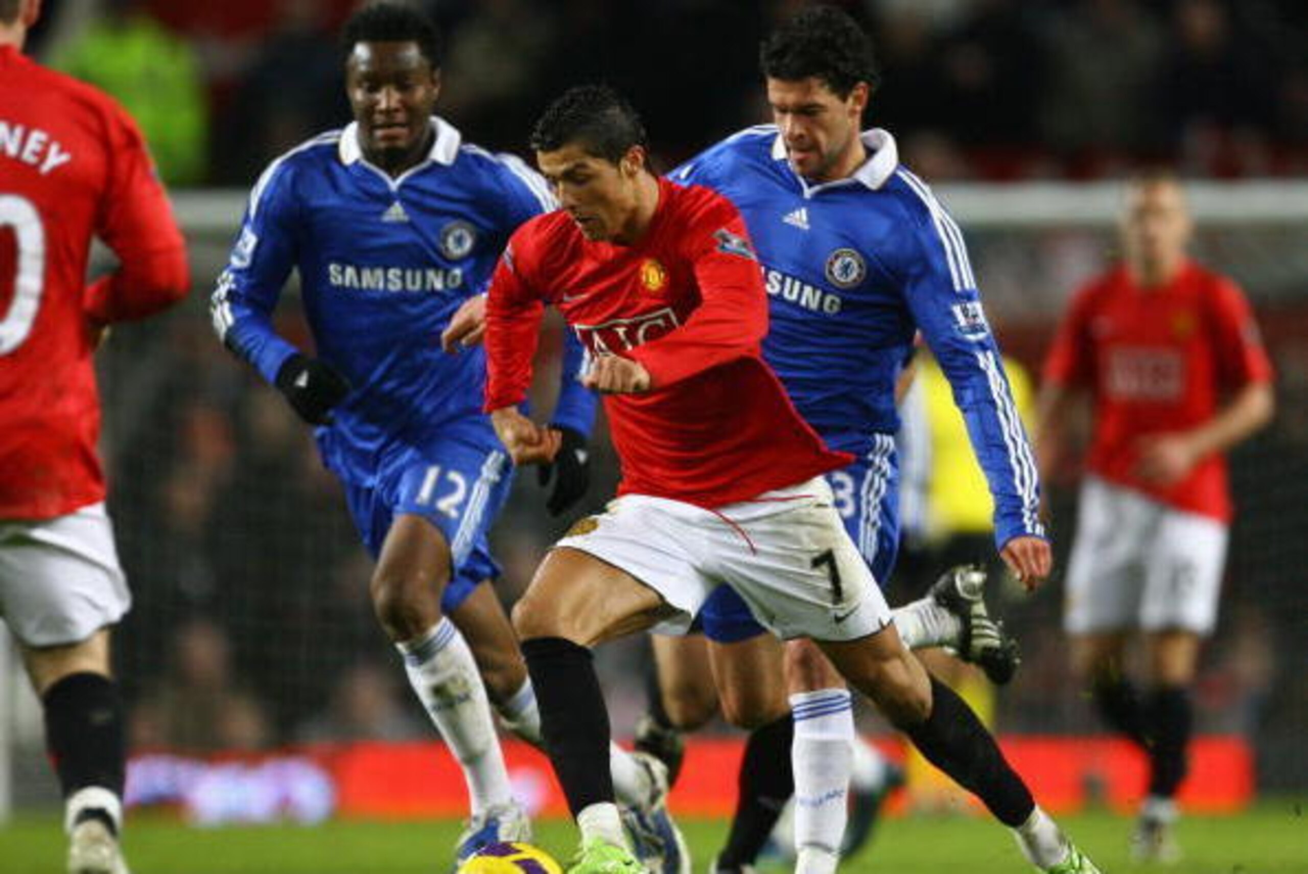 MANCHESTER, UNITED KINGDOM - JANUARY 11:  Cristiano Ronaldo of Manchester United goes past Michael Ballack of Chelsea during the Barclays Premier League match between Manchester United and Chelsea at Old Trafford on January 11, 2009 in Manchester, England