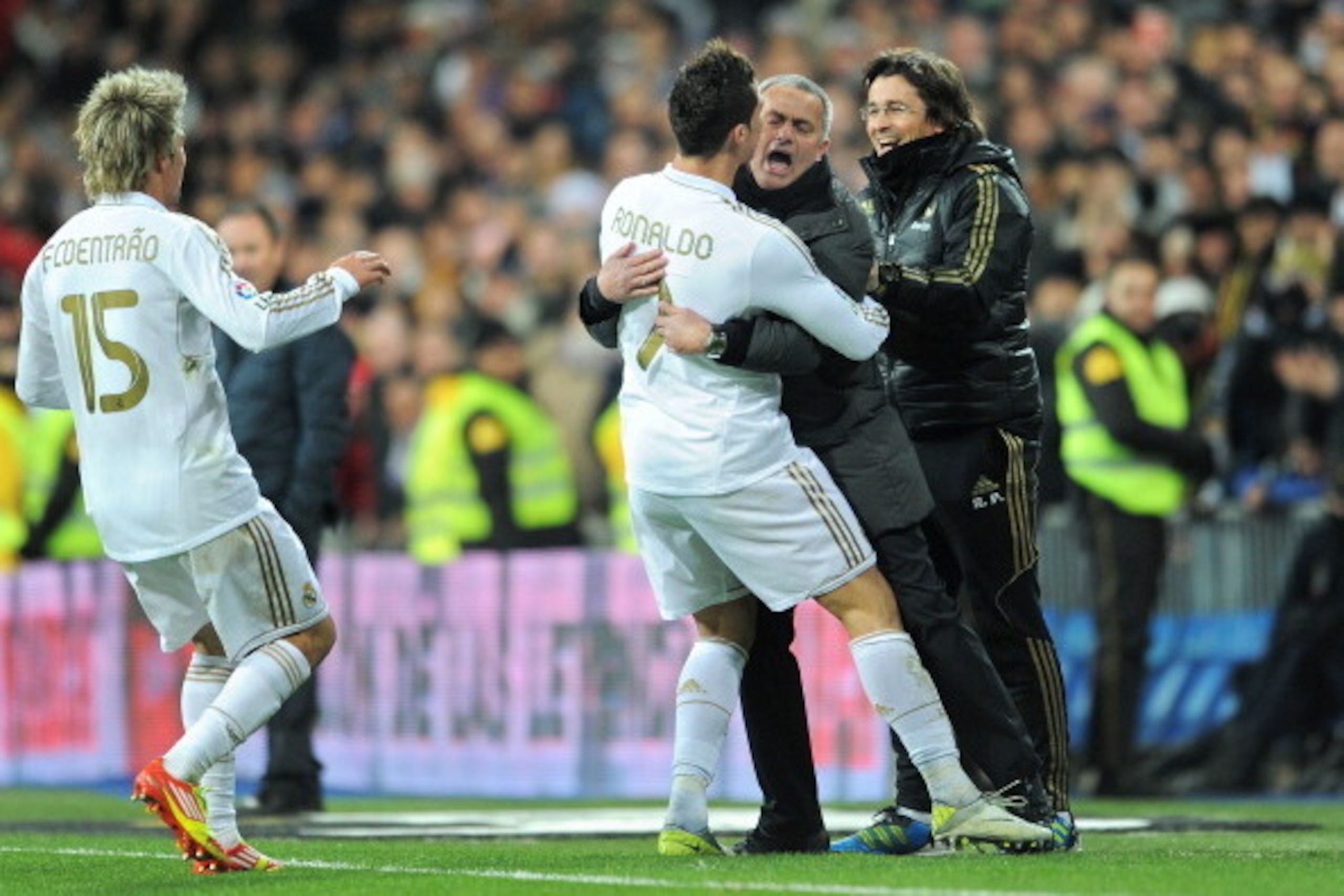 MADRID, SPAIN - FEBRUARY 12:  Cristiano Ronaldo (L) of Real Madrid celebrates scoring his sides second goial with head coach Jose Mourinho of Real Madrid during the la Liga match between Real Madrid and Levante at Estadio Santiago Bernabeu on February 12,