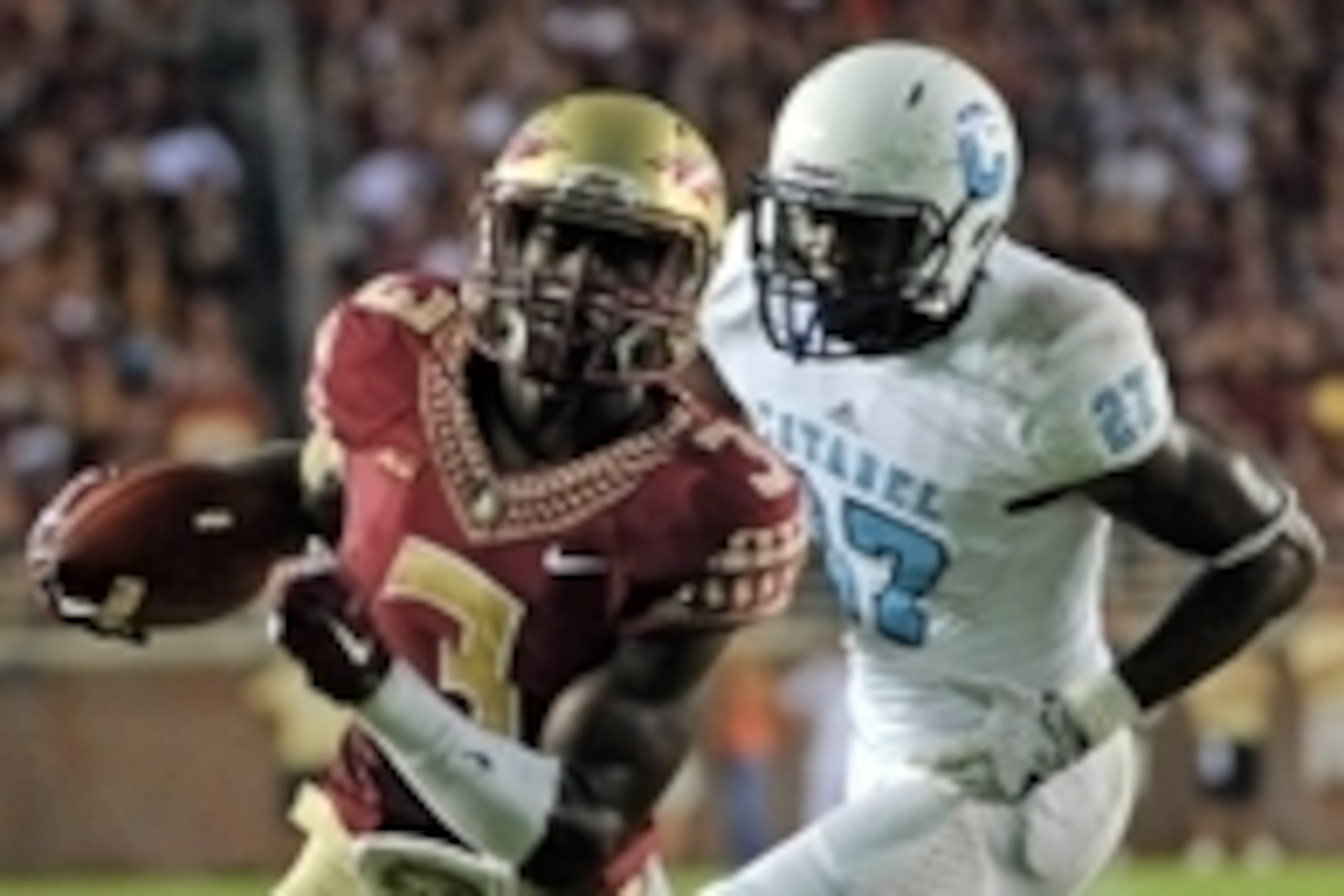Sep 6, 2014; Tallahassee, FL, USA; Florida State Seminoles wide receiver Jesus Wilson (3) runs the ball in for a touchdown past Citadel Bulldogs defensive back Nick Willis (27) at Doak Campbell Stadium. Mandatory Credit: Melina Vastola-USA TODAY Sports