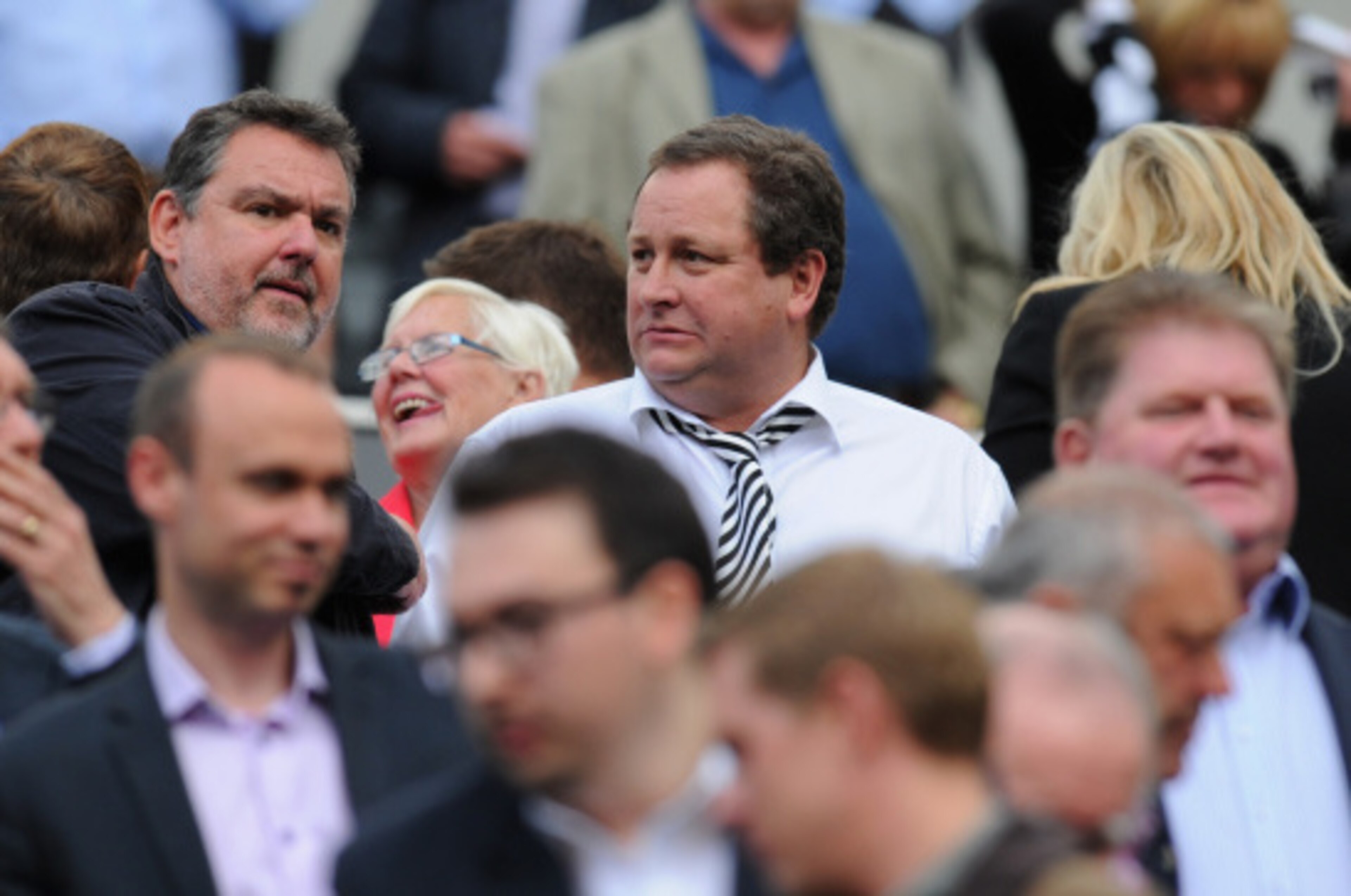 NEWCASTLE UPON TYNE, ENGLAND - AUGUST 17:  Newcastle owner Mike Ashley (c) looks on before the Barclays Premier League match between Newcastle United and Manchester City at St James' Park on August 17, 2014 in Newcastle upon Tyne, England.  (Photo by Stu 