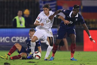 BELGRADE, SERBIA - SEPTEMBER 07: Lazar Markovic (L) of Serbia is challenged by Paul Pogba (R) during the International friendly match between Serbia and France at the Stadium JNA on September 07, 2014 in Belgrade, Serbia, 2014. (Photo by Srdjan Stevanovic