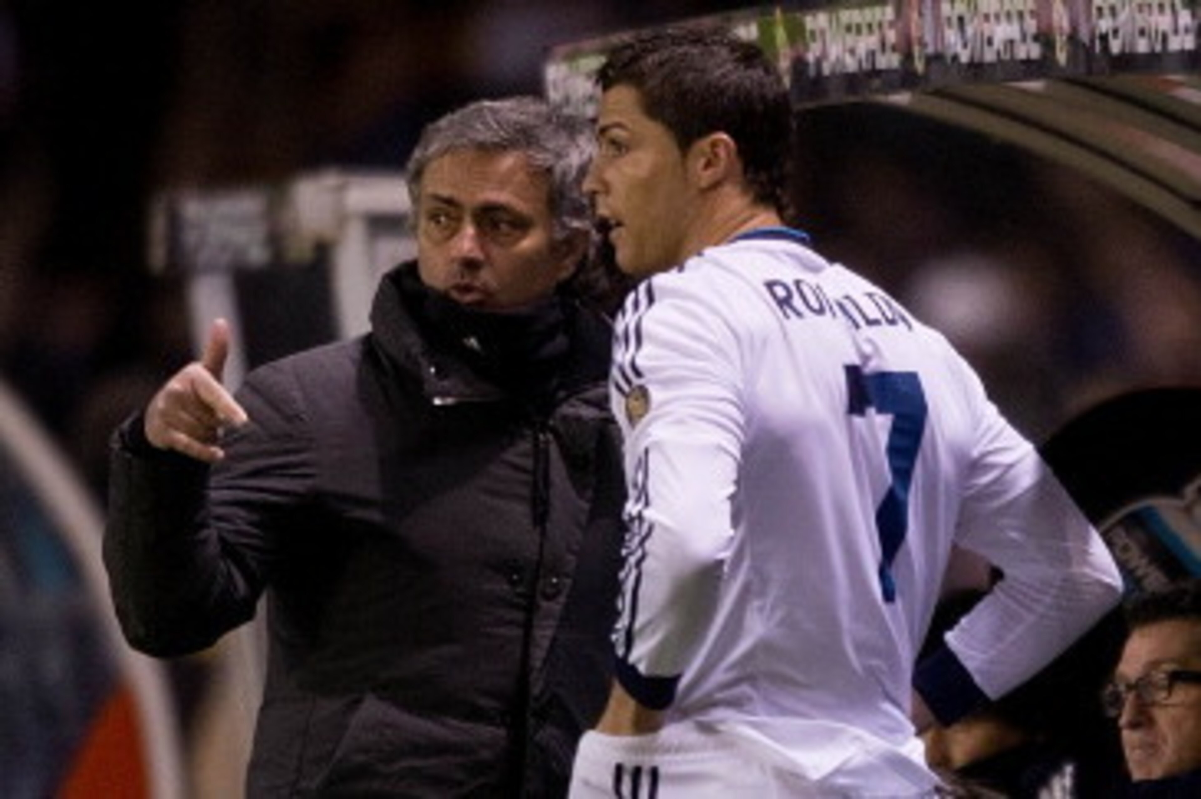 LA CORUNA, SPAIN - FEBRUARY 23: Head coach Jose Mourinho (L) of Real Madrid CF gives instructions to Cristiano Ronaldo (2ndl) on the desk during the La Liga match between RC Deportivo La Coruna and Real Madrid CF at Riazor Stadium on February 23, 2013 in LA CORUNA, SPAIN - FEBRUARY 23: Head coach Jose Mourinho (L) of Real Madrid CF gives instructions to Cristiano Ronaldo (2ndl) on the desk during the La Liga match between RC Deportivo La Coruna and Real Madrid CF at Riazor Stadium on February 23, 2013 in