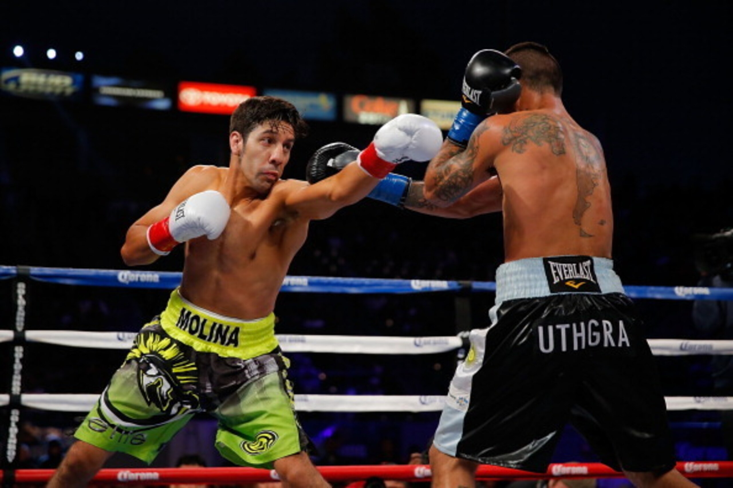 LOS ANGELES, CA - APRIL 26:  John Molina punches Lucas Matthysse during their fight at StubHub Center on April 26, 2014 in Los Angeles, California.  (Photo by Joe Scarnici/Getty Images)