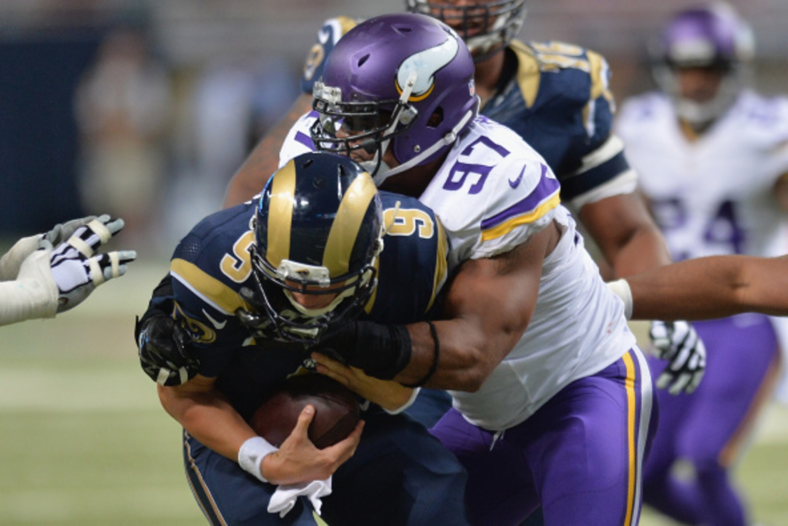 ST. LOUIS, MO - SEPTEMBER 7:  Everson Griffen #97 of the Minnesota Vikings sacks Austin Davis #9 of the St. Louis Rams in the fourth quarter at the Edward Jones Dome on September 7, 2014 in St. Louis, Missouri. The Vikings defeated the Rams 34-6.  (Photo 