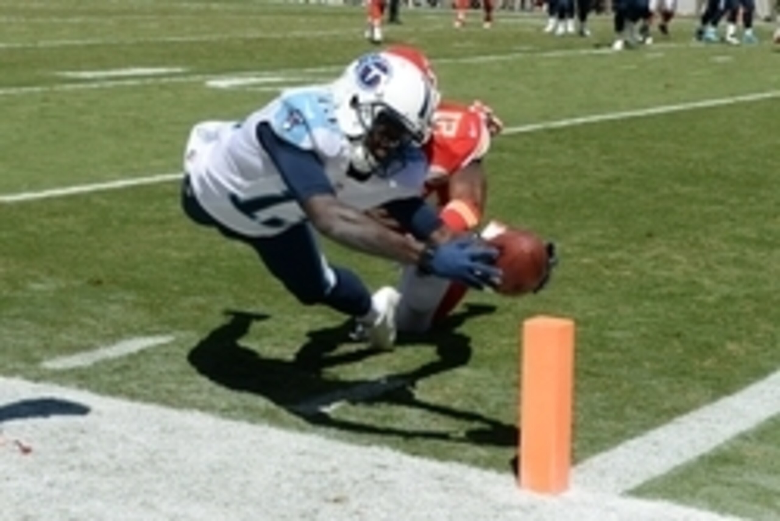 Sep 7, 2014; Kansas City, MO, USA; Tennessee Titans wide receiver Kendall Wright (13) dives in for a touchdown against Kansas City Chiefs cornerback Sean Smith (21) in the second half at Arrowhead Stadium. Tennessee won the game 26-10. Mandatory Credit: J