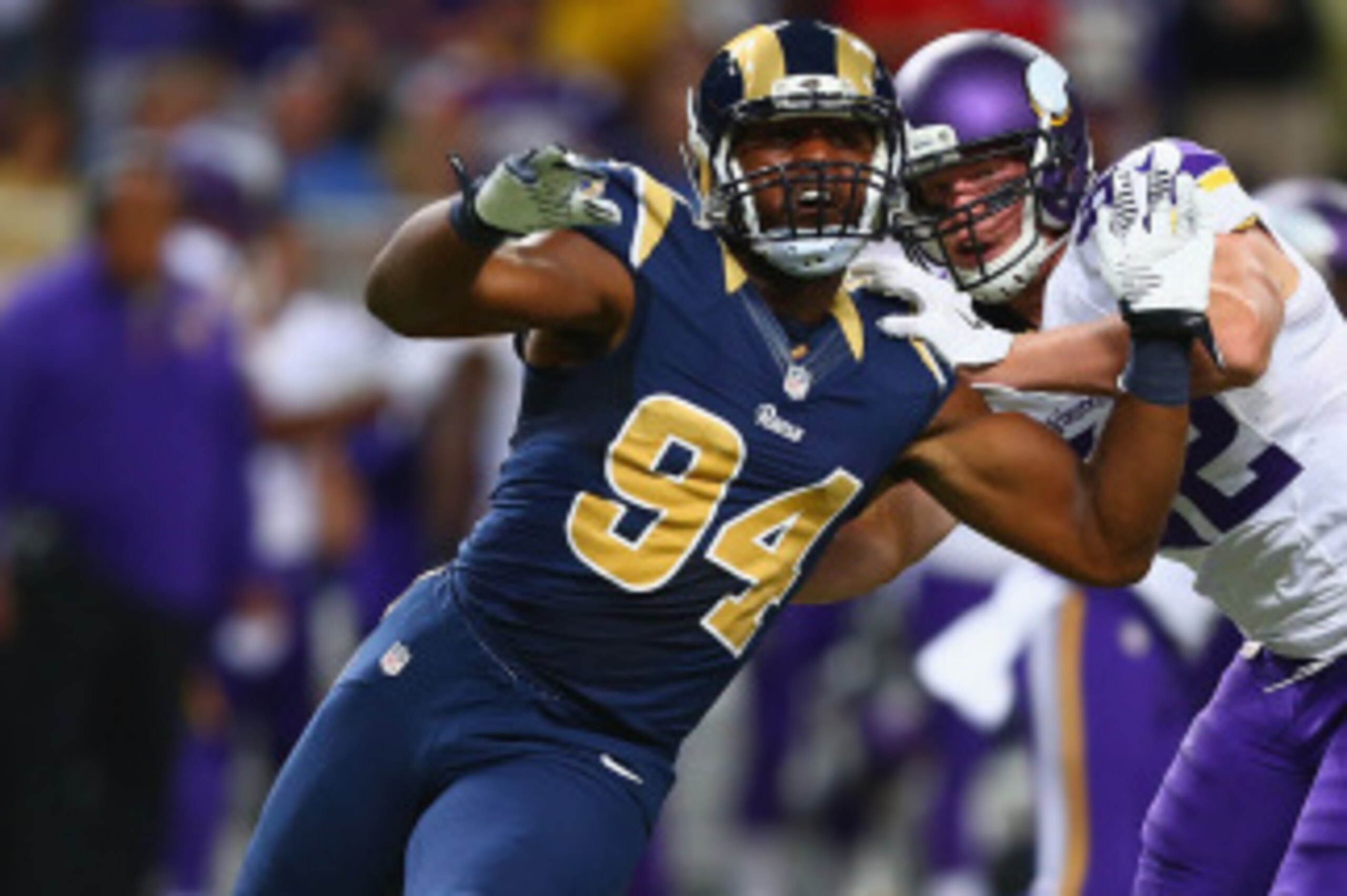 ST. LOUIS, MO - SEPTEMBER 7: Robert Quinn #94 of the St. Louis Rams rushes past Kyle Rudolph #82 of the Minnesota Vikings at the Edward Jones Dome on September 7, 2014 in St. Louis, Missouri.  The Vikings beat the Rams 34-6.  (Photo by Dilip Vishwanat/Get