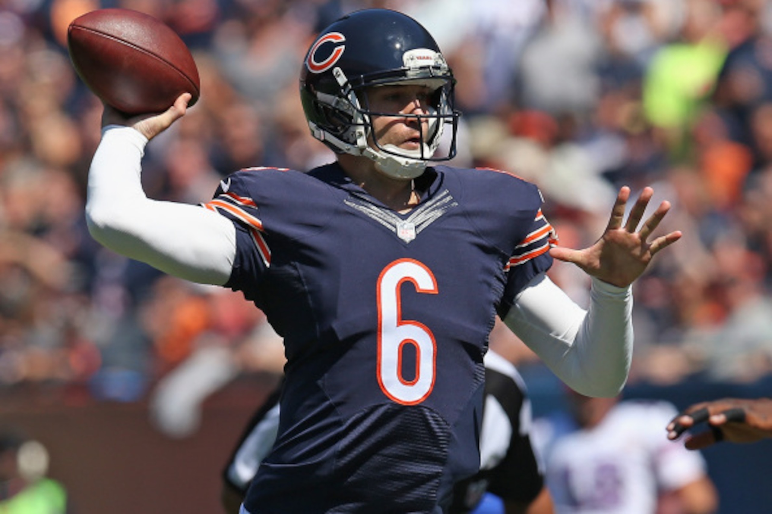 CHICAGO, IL - SEPTEMBER 07:  Jay Cutler #6 of the Chicago Bears throws a touchdown pass during the first quarter of their game against the Buffalo Bills at Soldier Field on September 7, 2014 in Chicago, Illinois.  The Bills defeated the Bears 23-20 in ove