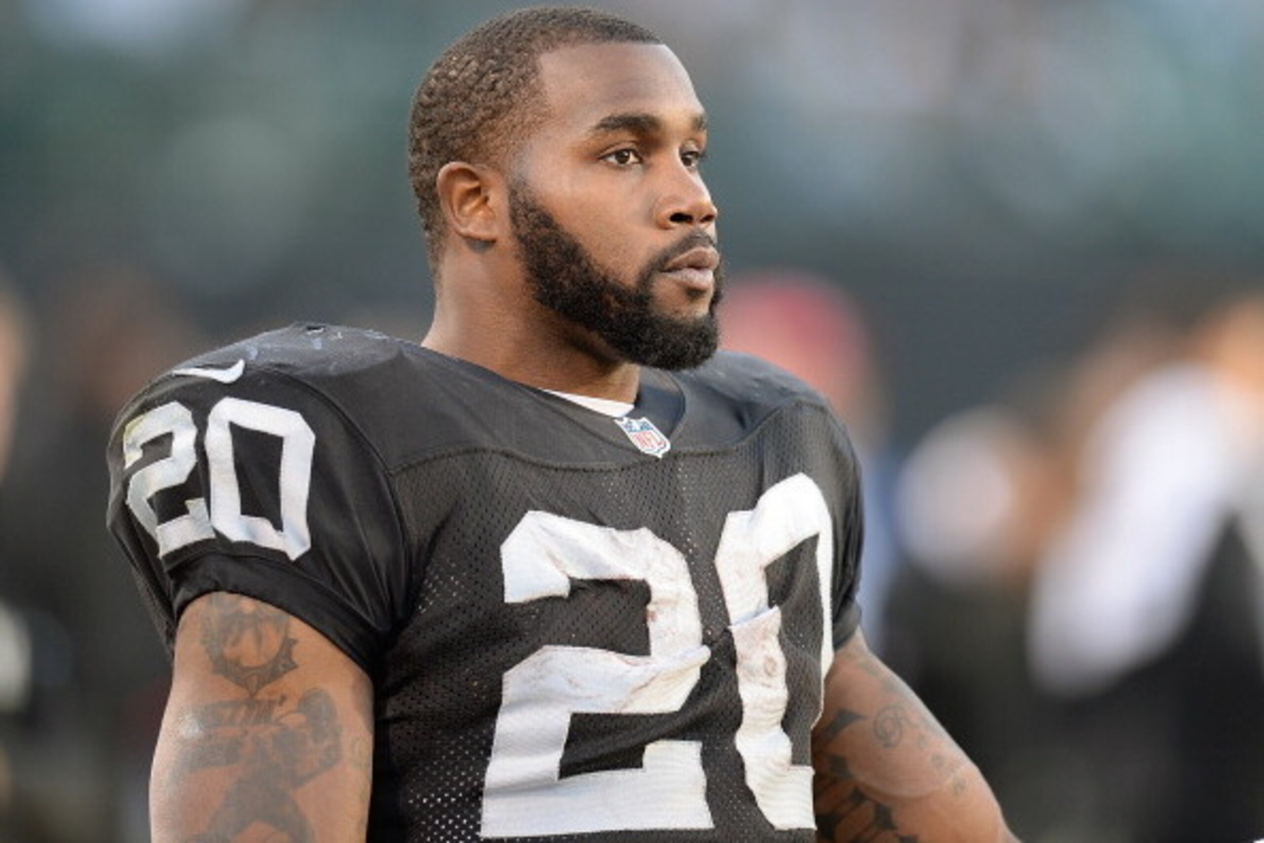 OAKLAND, CA - DECEMBER 29:  Darren McFadden #20 of the Oakland Raiders looks on from the sidelines against the Denver Broncos during the fourth quarter at O.co Coliseum on December 29, 2013 in Oakland, California. The Broncos won the game 34-14.  (Photo b