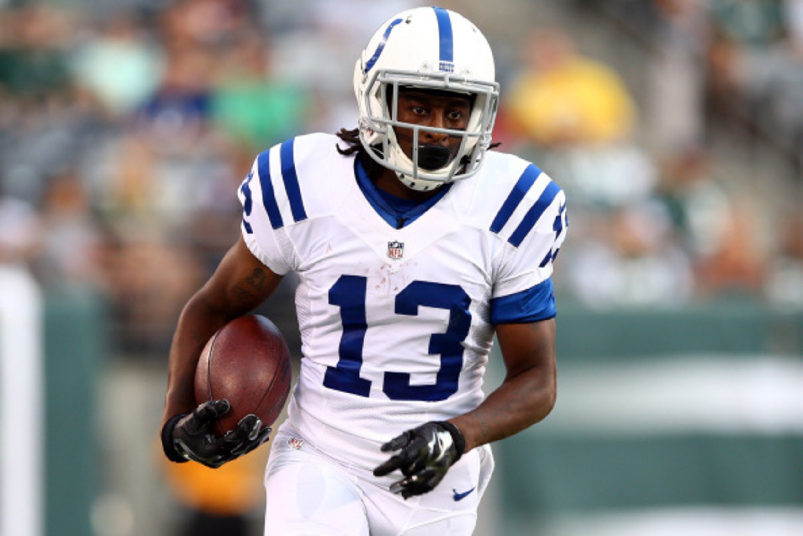 EAST RUTHERFORD, NJ - AUGUST 07: Wide receiver T.Y. Hilton #13 of the Indianapolis Colts runs with the ball against the New York Jets during a preseason game at MetLife Stadium on August 7, 2014 in East Rutherford, New Jersey.  (Photo by Elsa/Getty Images