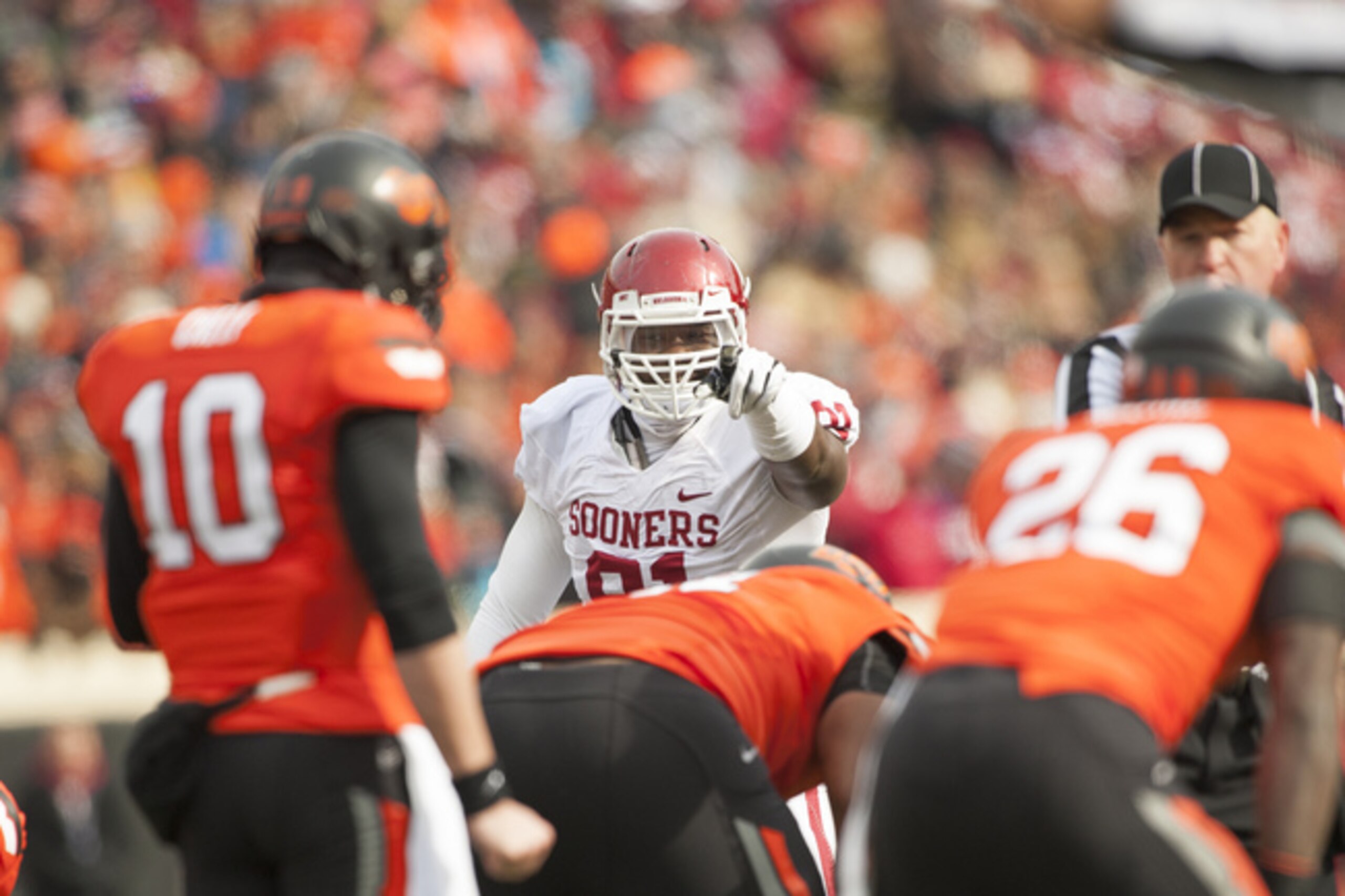 Charles Tapper (pointing) and the D-line will be a key piece for OU.