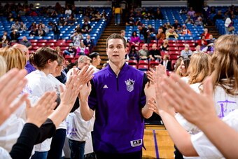 SACRAMENTO, CA - MARCH 8: Jimmer Fredette #7 of the Sacramento Kings greets fans before a game against the Phoenix Suns on March 8, 2013 at Sleep Train Arena in Sacramento, California. NOTE TO USER: User expressly acknowledges and agrees that, by download