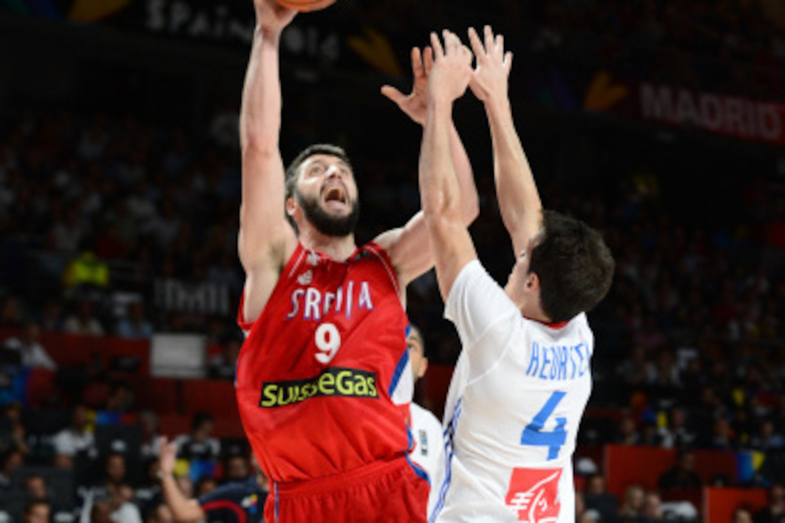 MADRID, SPAIN - SEPTEMBER 12: Stefan Markovic #9 of the Serbia National Team shoots against Thomas Huertel #4 of the France National Team at Palacio de Deportes on September 12, 2014 in Madrid, Spain.  NOTE TO USER: User expressly acknowledges and agrees 