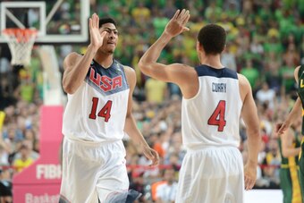 BARCELONA, SPAIN - SEPTEMBER 11: Anthony Davis #14 high fives Stephen Curry #4 of the USA Basketball Men's National Team in the game against the Lithuania National Team during the 2014 FIBA World Cup Semi-Finals at Palau Sant Jordi on September 11, 2014 i