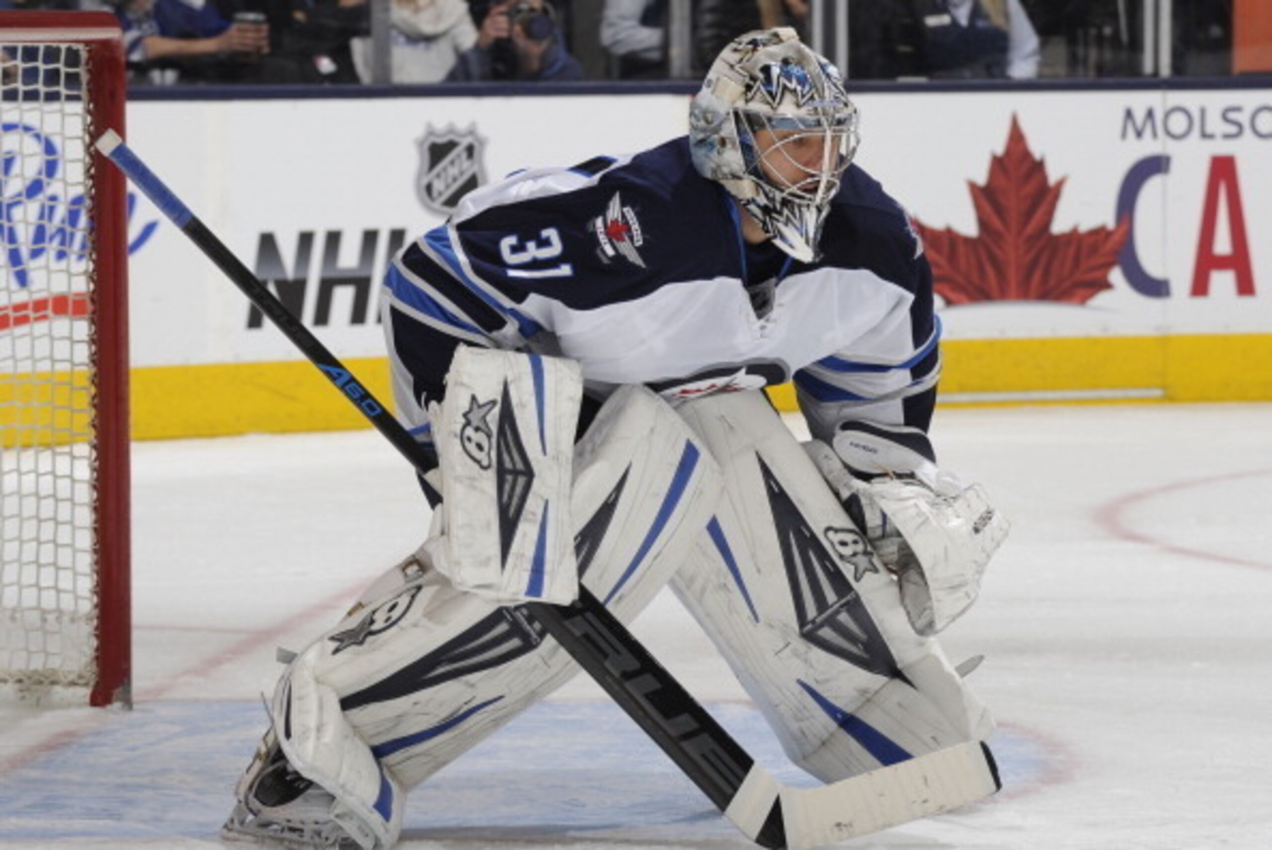 TORONTO, ON - APRIL 5: Ondrej Pavelec #31 of the Winnipeg Jets defends the goal during NHL game action against the Toronto Maple Leafs April 5, 2014 at the Air Canada Centre in Toronto, Ontario, Canada. (Photo by Graig Abel/NHLI via Getty Images)