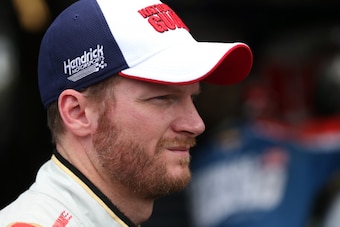 JOLIET, IL - SEPTEMBER 12:  Dale Earnhardt Jr., driver of the #88 National Guard Chevrolet, stands in the garage area during practice for the NASCAR Sprint Cup Series MyAFibStory.com 400 at Chicagoland Speedway on September 12, 2014 in Joliet, Illinois.  