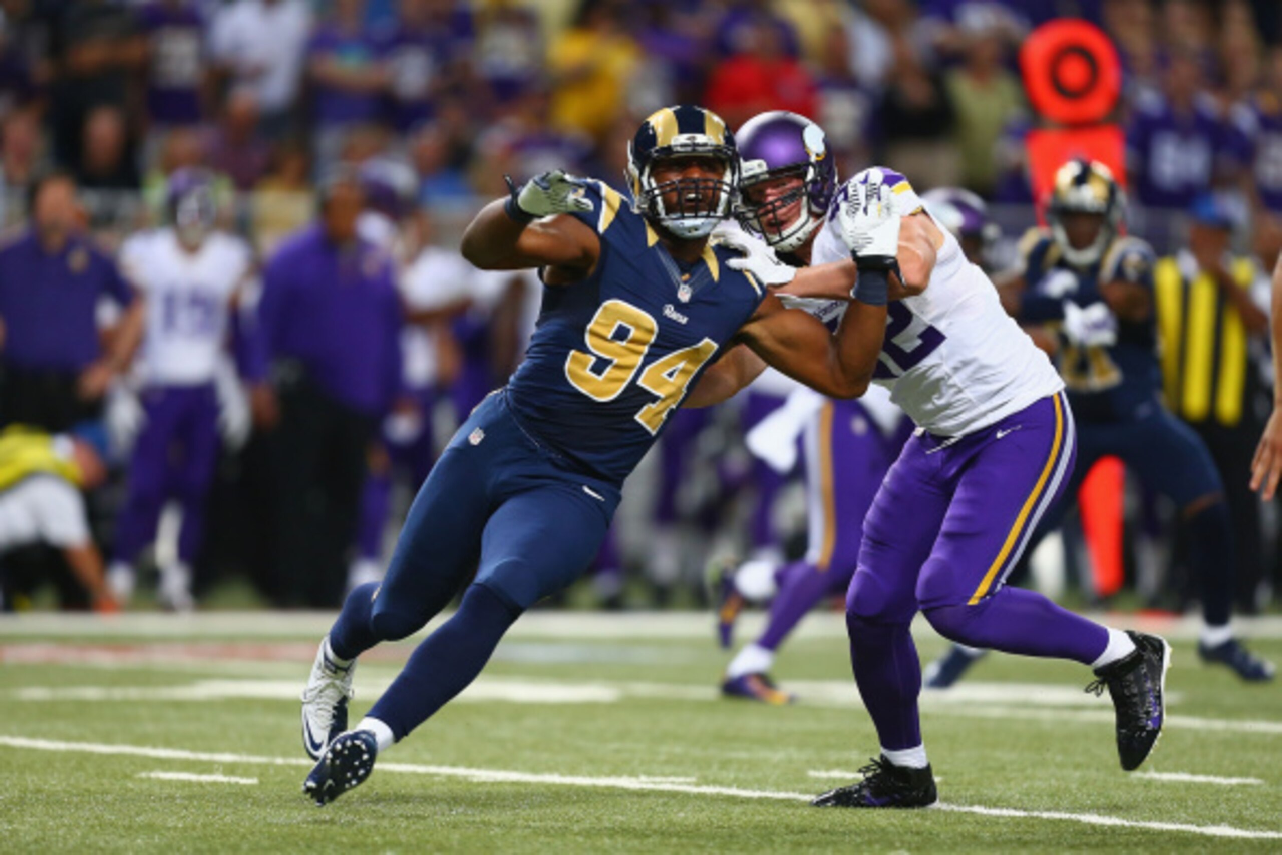 ST. LOUIS, MO - SEPTEMBER 7: Robert Quinn #94 of the St. Louis Rams rushes past Kyle Rudolph #82 of the Minnesota Vikings at the Edward Jones Dome on September 7, 2014 in St. Louis, Missouri.  The Vikings beat the Rams 34-6.  (Photo by Dilip Vishwanat/Get