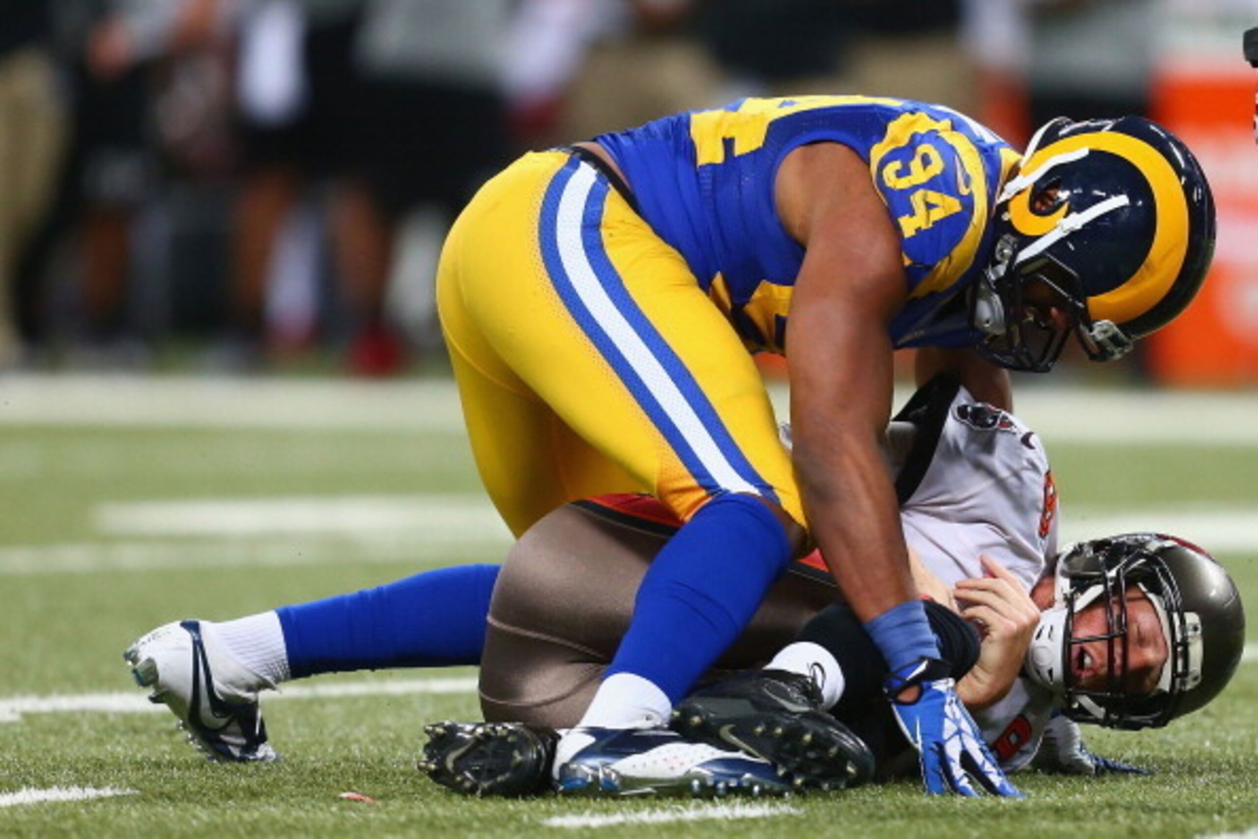 ST. LOUIS, MO - DECEMBER 22: Robert Quinn #94 of the St. Louis Rams sacks Mike Glennon #8 of the Tampa Bay Buccaneers at the Edward Jones Dome on December 22, 2013 in St. Louis, Missouri.  The Rams beat the Buccaneers 23-13.  (Photo by Dilip Vishwanat/Get