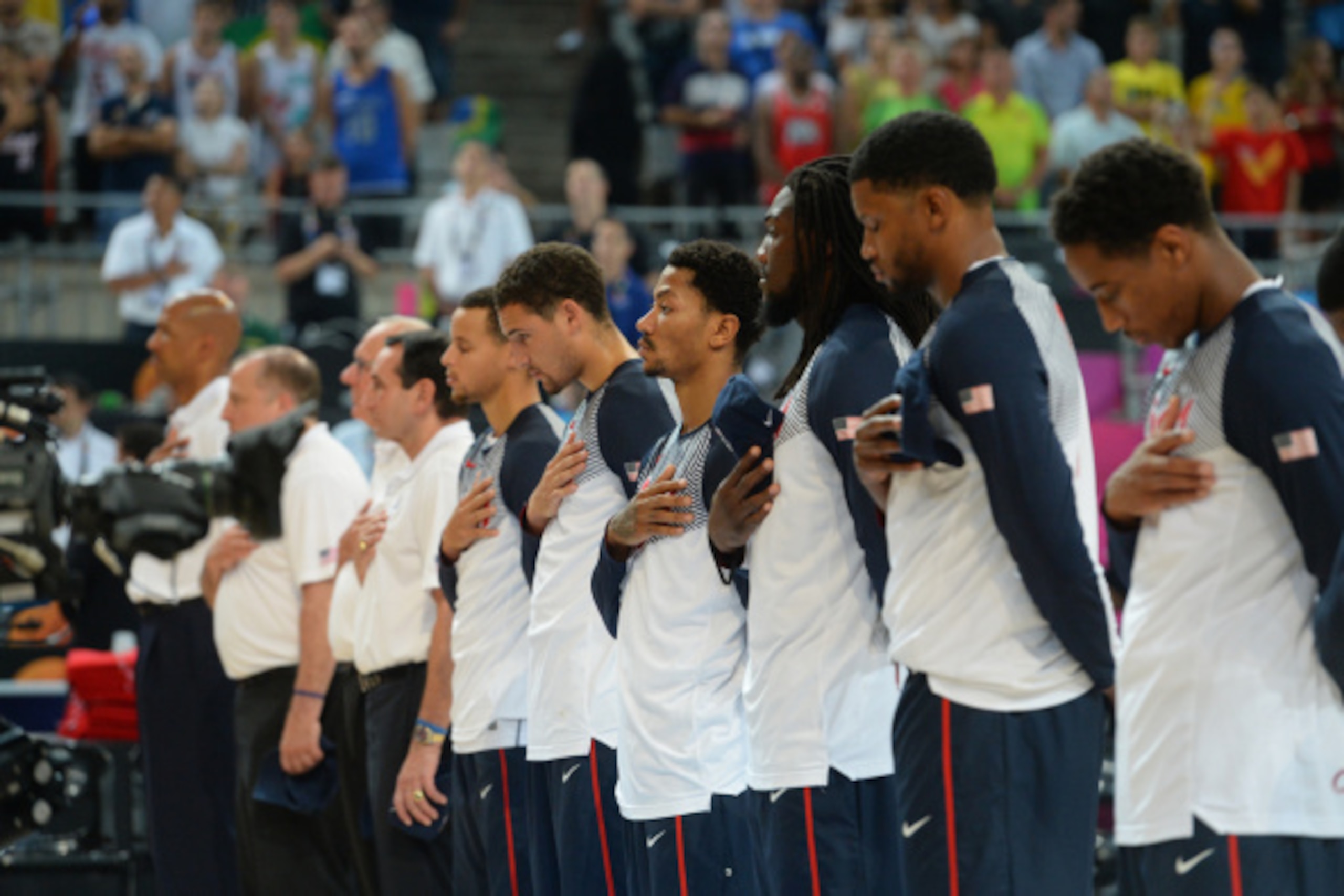BARCELONA, SPAIN - SEPTEMBER 11: Members of the USA Basketball Men's National Team stands for the National Anthem against the Lithuania National Team during the 2014 FIBA World Cup Semi-Finals at Palau Sant Jordi on September 11, 2014 in Barcelona, Spain.