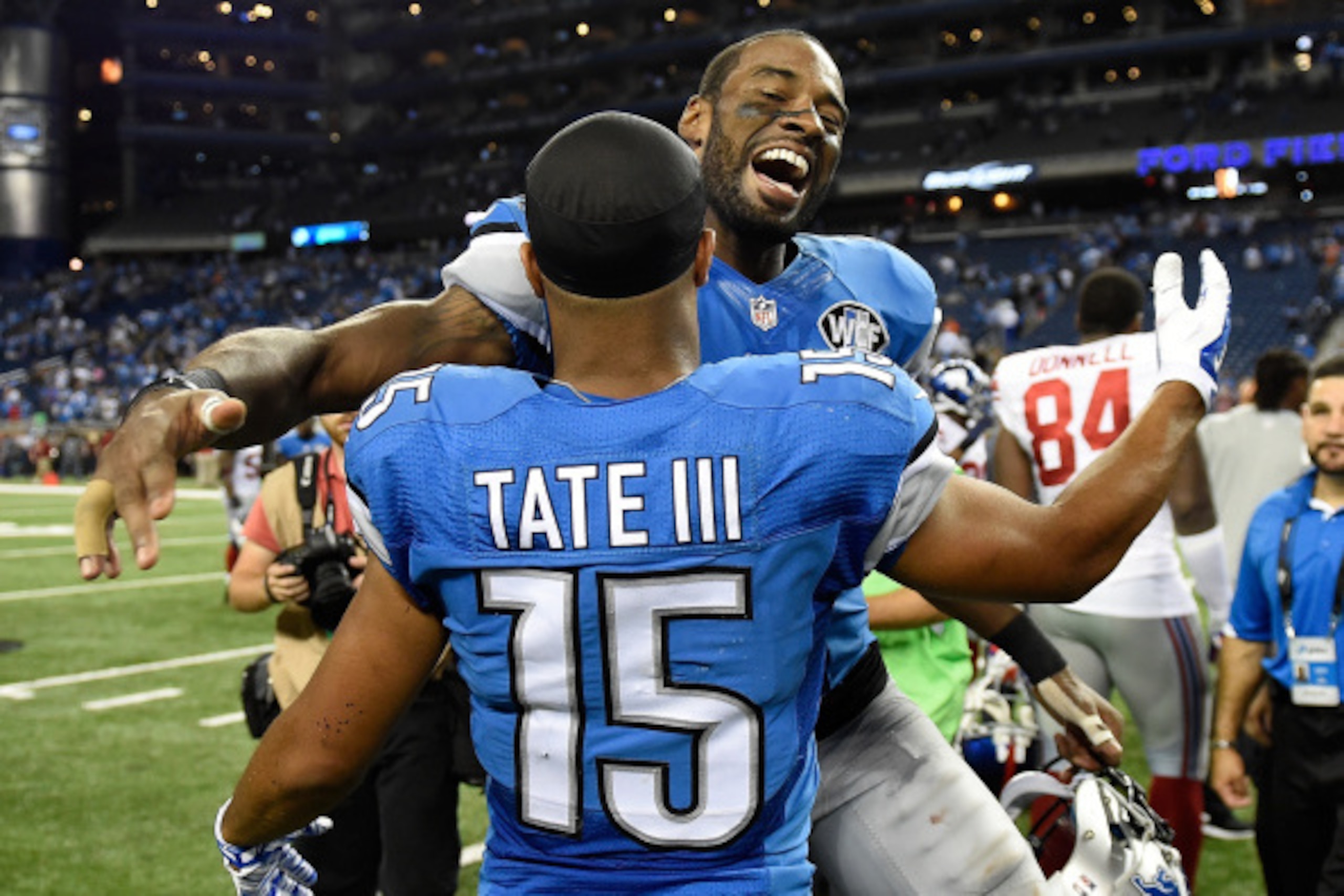 DETROIT, MI - SEPTEMBER 08:  Calvin Johnson #81 of the Detroit Lions celebrates with Golden Tate #15 after a 35-14 win over the New York Giants at Ford Field on September 8, 2014 in Detroit, Michigan. (Photo by Joe Sargent/Getty Images)