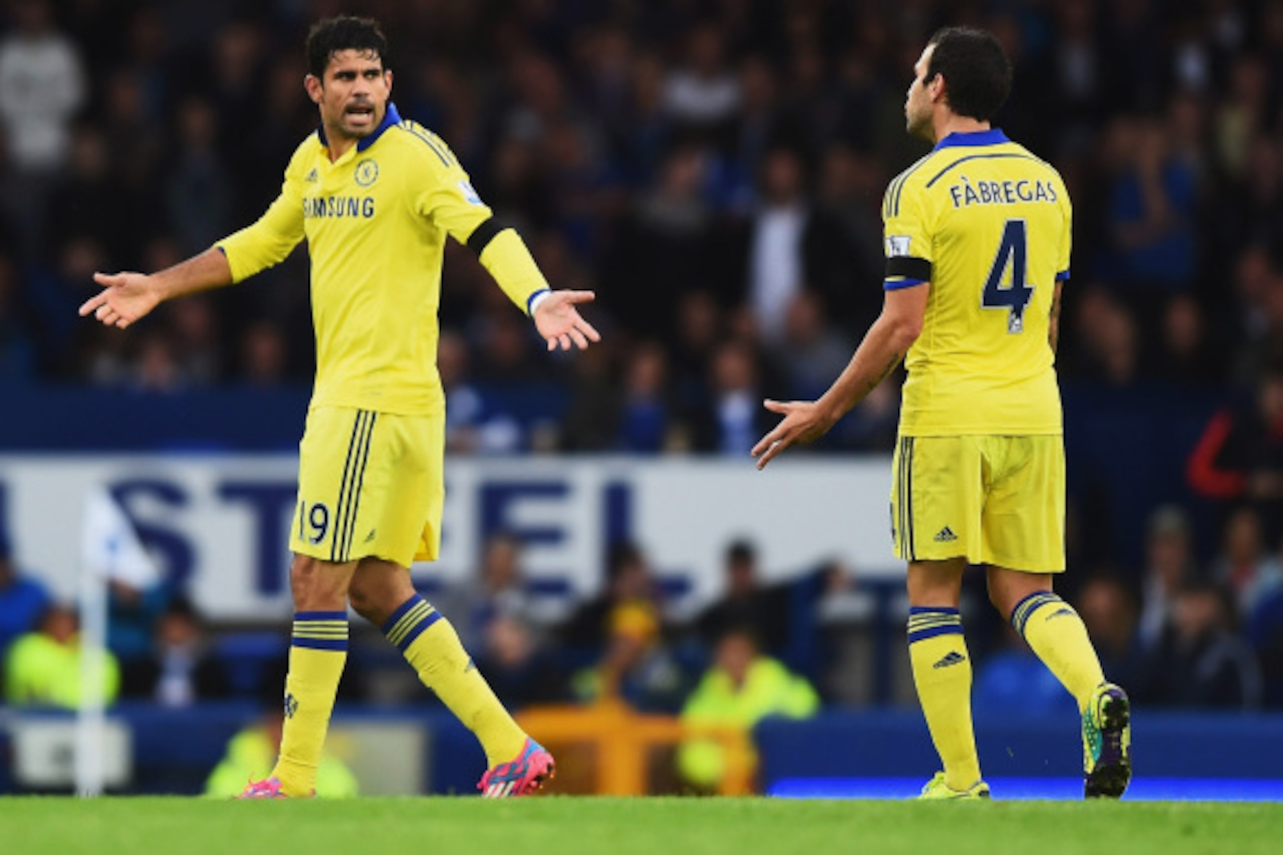 LIVERPOOL, ENGLAND - AUGUST 30: Diego Costa of Chelsea exchanges words with Cesc Fabregas of Chelsea during the Barclays Premier League match between Everton and Chelsea at Goodison Park on August 30, 2014 in Liverpool, England.  (Photo by Laurence Griffi