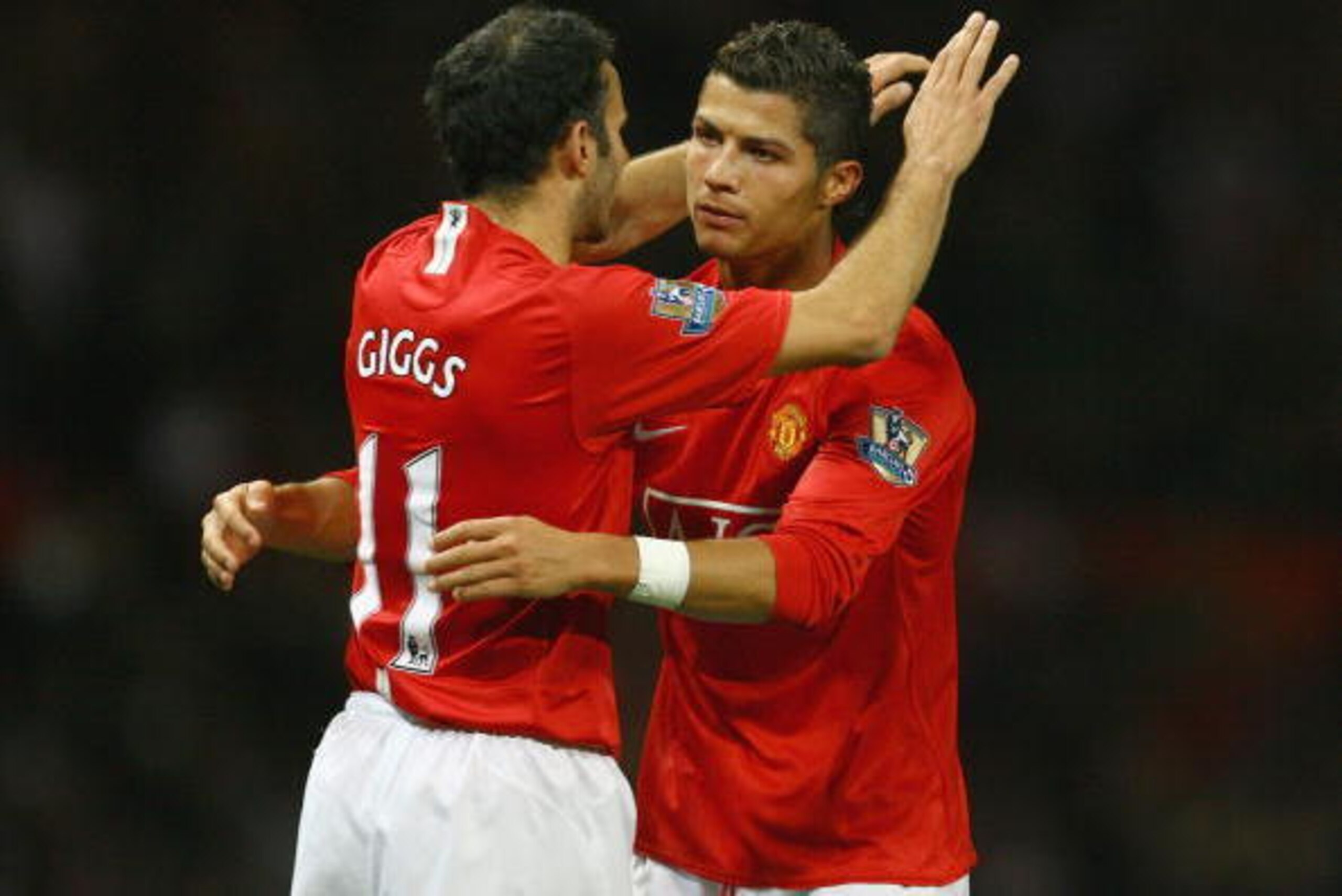 MANCHESTER, UNITED KINGDOM - SEPTEMBER 23:  Cristiano Ronaldo of Manchester United celebrates with Ryan Giggs after scoring the opening goal during the Carling Cup third round match between Manchester United and Middlesbrough at Old Trafford on September 