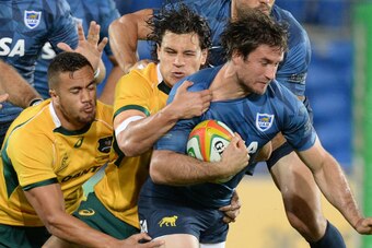 GOLD COAST, AUSTRALIA - SEPTEMBER 13: Marcelo Bosch of Argentina attempts to break free from the defence during The Rugby Championship match between the Australian Wallabies and Argentina at Cbus Super Stadium on September 13, 2014 in Gold Coast, Australi