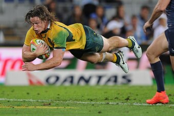 GOLD COAST, AUSTRALIA - SEPTEMBER 13:  Michael Hooper of the Wallabies scores a try during The Rugby Championship match between the Australian Wallabies and Argentina at Cbus Super Stadium on September 13, 2014 on the Gold Coast, Australia.  (Photo by Mat