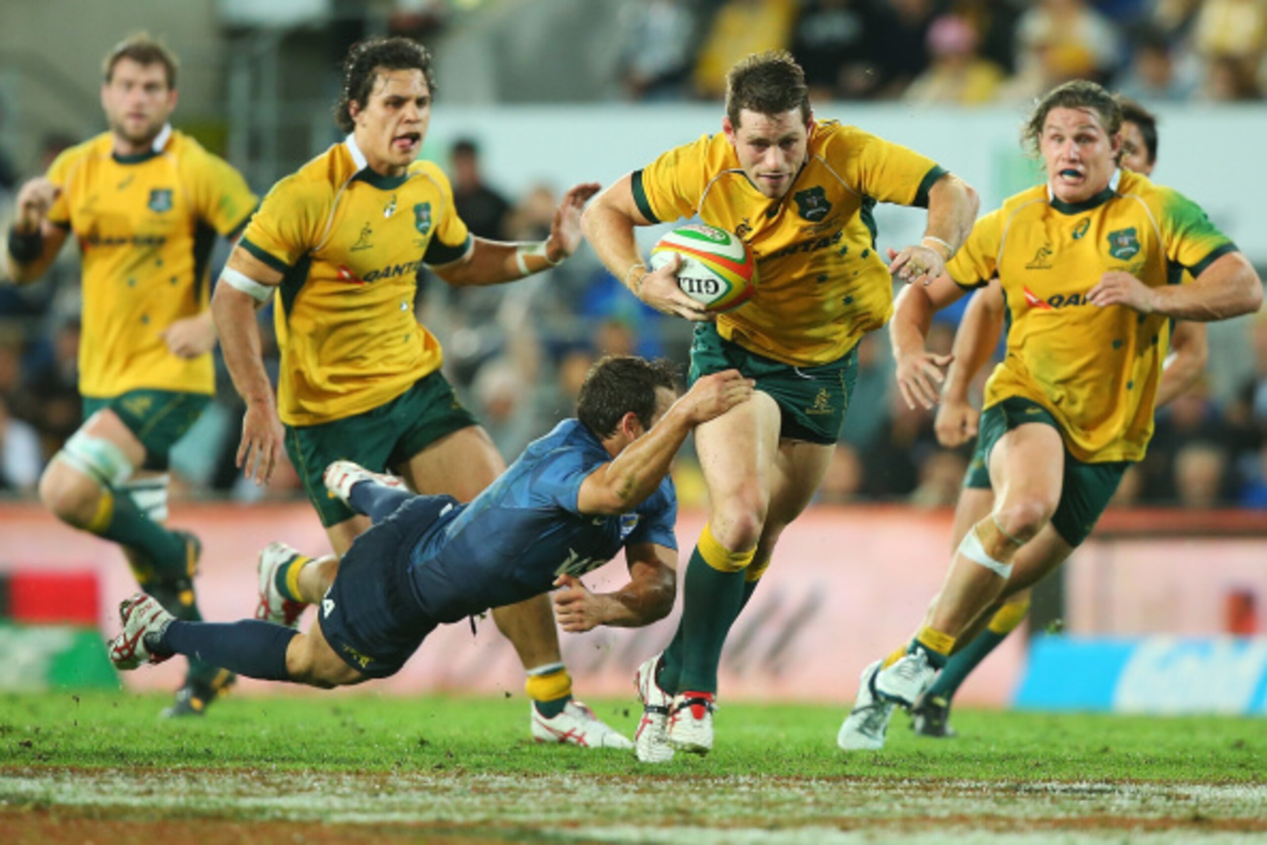 GOLD COAST, AUSTRALIA - SEPTEMBER 13:  Bernard Foley of the Wallabies makes a break during The Rugby Championship match between the Australian Wallabies and Argentina at Cbus Super Stadium on September 13, 2014 in Gold Coast, Australia.  (Photo by Chris H
