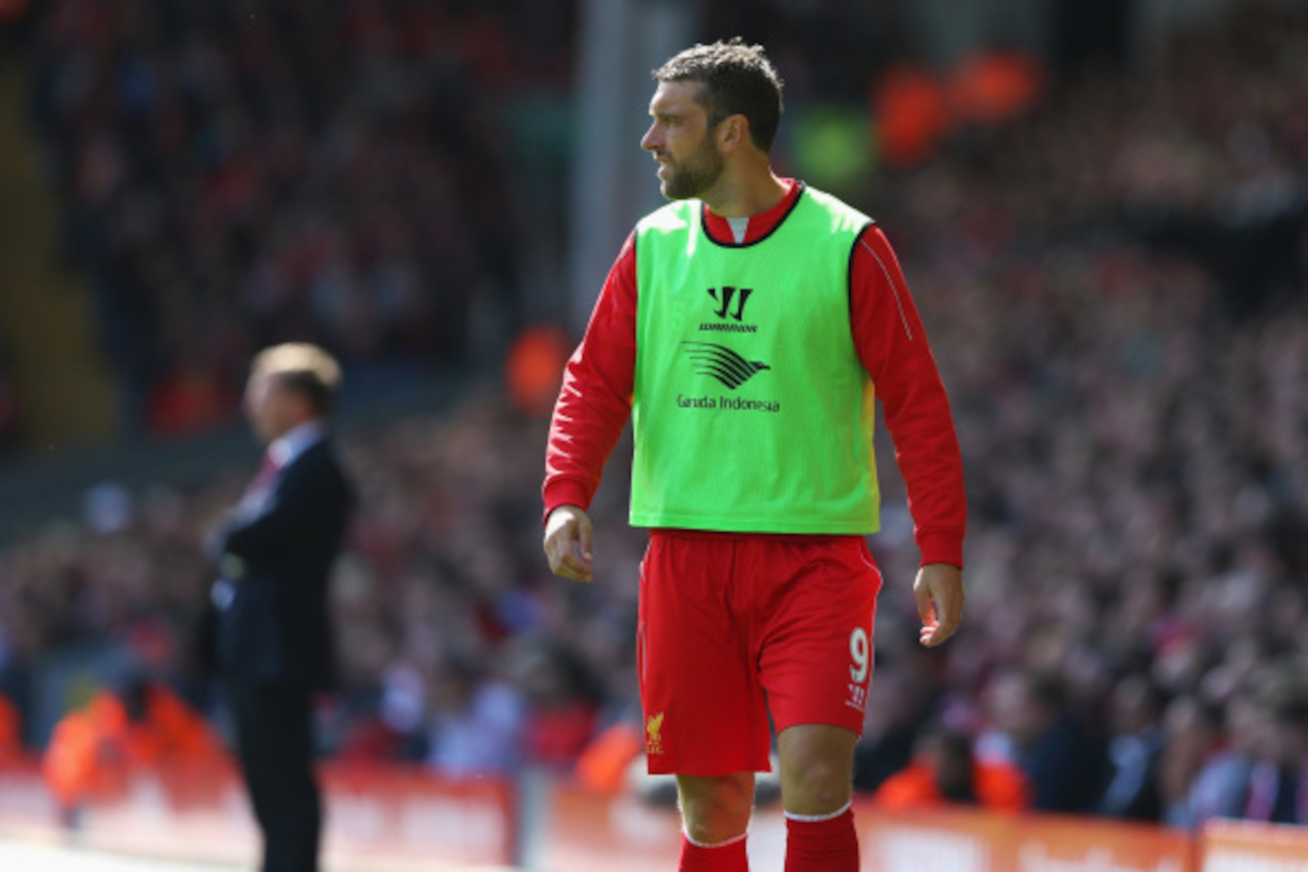 LIVERPOOL, ENGLAND - AUGUST 17: Rickie Lambert of Liverpool looks on from the sidelines during the Barclays Premier League match between Liverpool and Southampton at Anfield on August 17, 2014 in Liverpool, England.  (Photo by Alex Livesey/Getty Images)