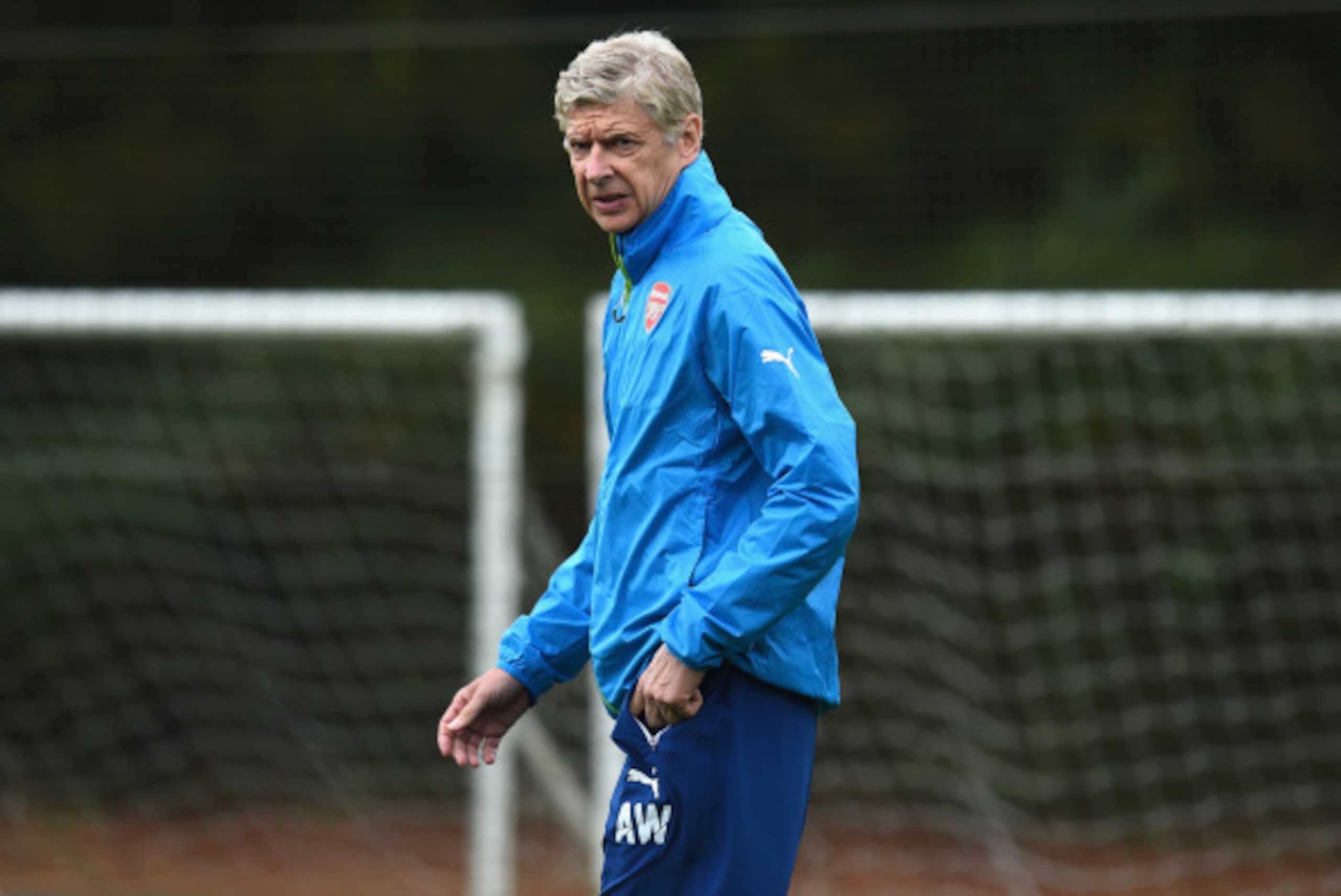 ST ALBANS, ENGLAND - AUGUST 26:  Arsenal manager Arsene Wenger during a training session at London Colney on August 26, 2014 in St Albans, England.  (Photo by Shaun Botterill/Getty Images)
