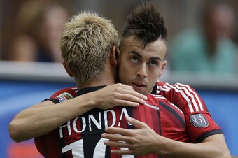 El Shaarawy celebrates goal with Keisuke Honda in Milan's first match against Lazio.