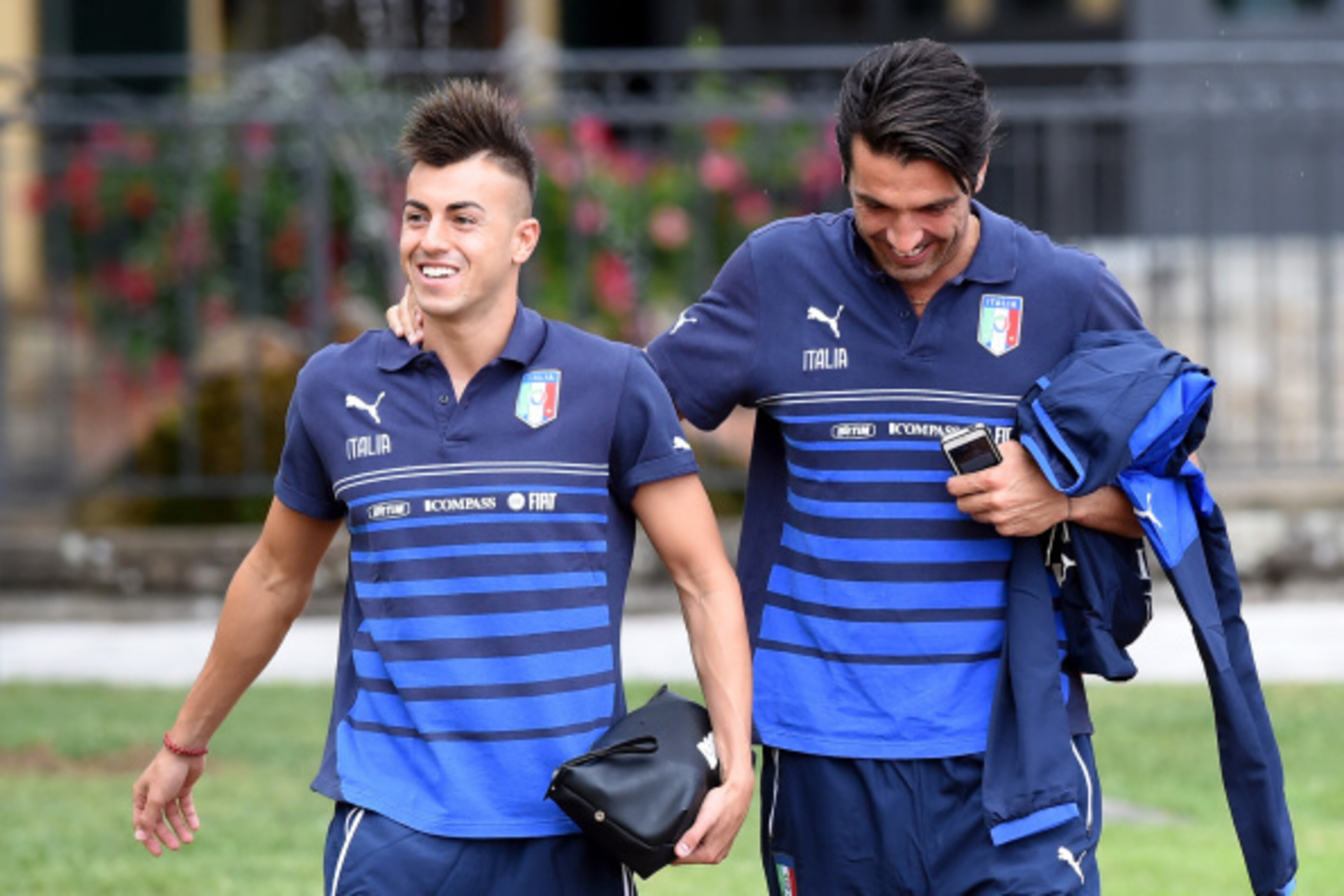 FLORENCE, ITALY - SEPTEMBER 02:  Stephan El Shaarawy (L) and Gianluigi Buffon prior to the Italy Training Session at Coverciano on September 2, 2014 in Florence, Italy.  (Photo by Claudio Villa/Getty Images)