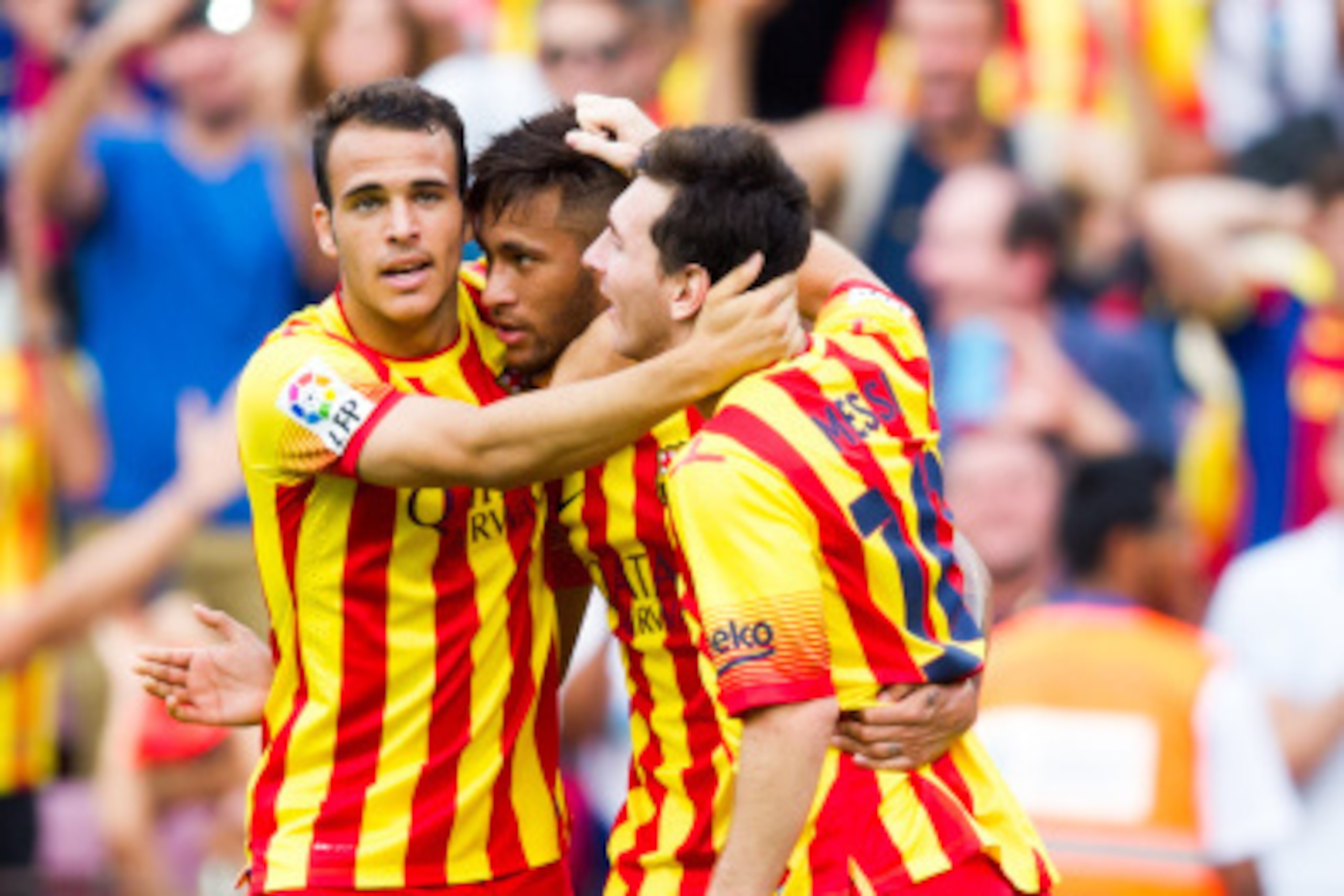 BARCELONA, SPAIN - SEPTEMBER 13: Neymar Santos Jr (C) of FC Barcelona is congratulated by his teammates Sandro Ramirez (L) and Lionel Messi (R) after scoring the opening goal during the La Liga match between FC Barcelona and Athletic Club at Camp Nou on S