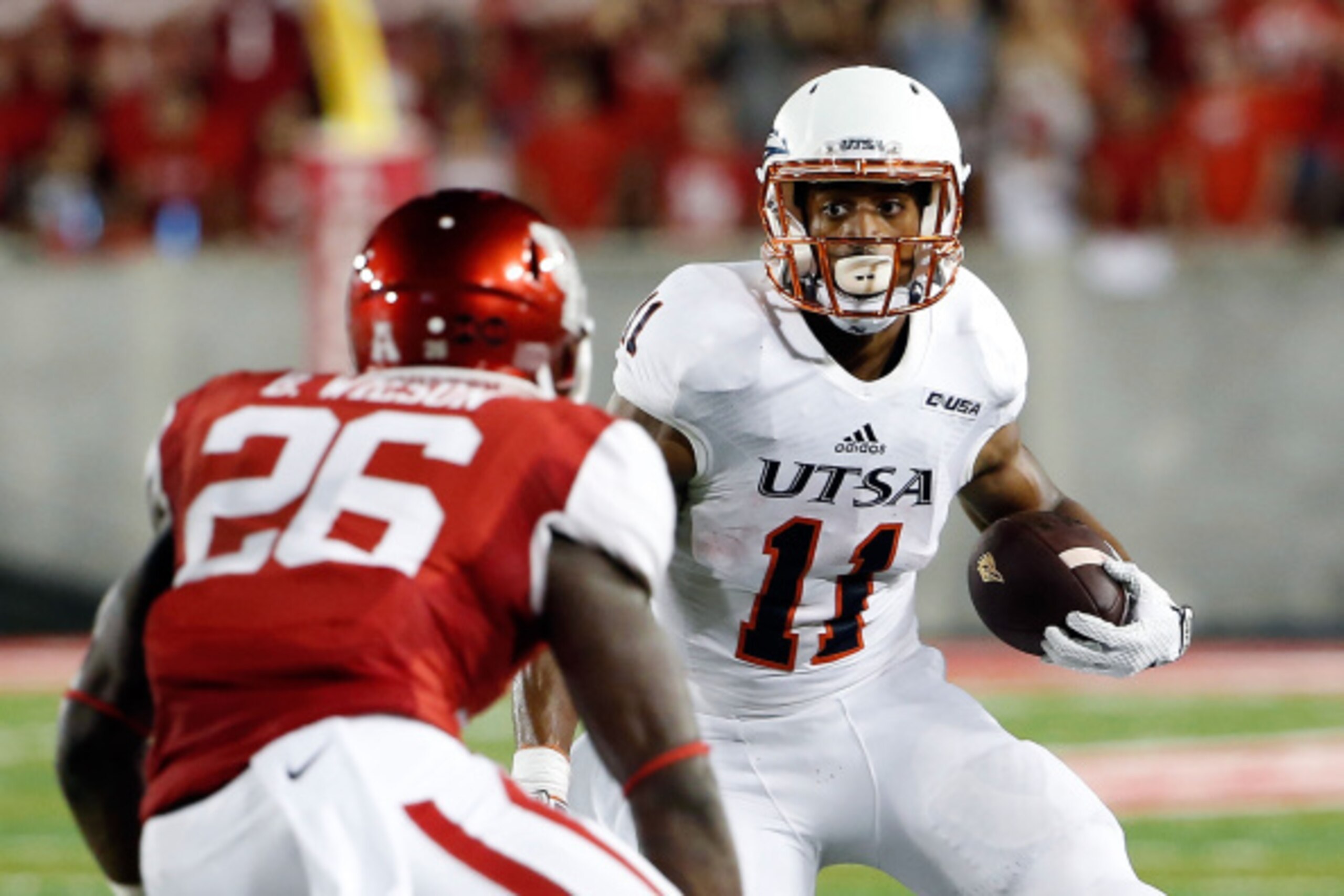 HOUSTON, TX - AUGUST 29: David Glasco II #11 of the UTSA Roadrunners is pursued by Brandon Wilson #26 of the Houston Cougars during a game at TDECU Stadium on August 29, 2014 in Houston, Texas. (Photo by Stacy Revere/Getty Images) HOUSTON, TX - AUGUST 29: David Glasco II #11 of the UTSA Roadrunners is pursued by Brandon Wilson #26 of the Houston Cougars during a game at TDECU Stadium on August 29, 2014 in Houston, Texas. (Photo by Stacy Revere/Getty Images)