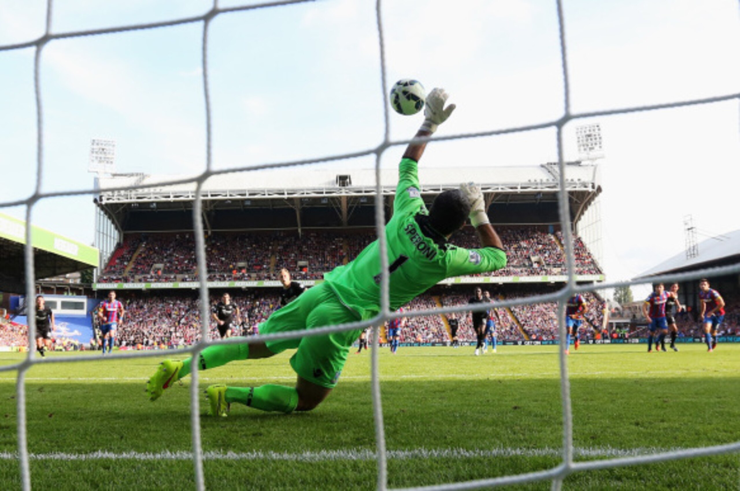 LONDON, ENGLAND - SEPTEMBER 13: Julian Speroni of Crystal Palace saves a penalty from Scott Arfield of Burnley during the Barclays Premier League match between Crystal Palace and Burnley at Selhurst Park on September 13, 2014 in London, England.  (Photo b