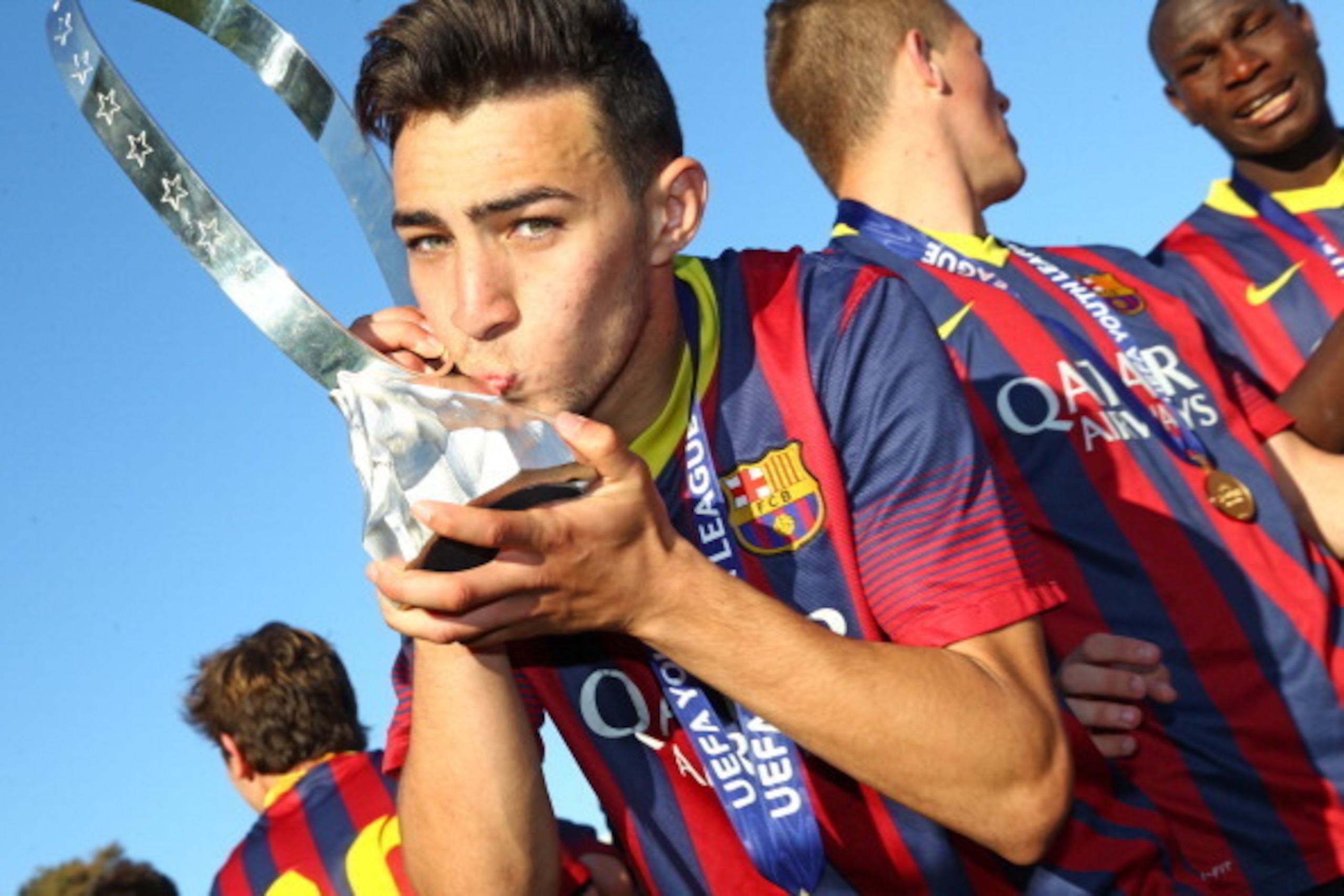 NYON, SWITZERLAND - APRIL 14: Munir El Haddadi of FC Barcelona kisses the Lennart Johansson trophy in celebration after victoy during the UEFA Youth League Final match between Benfica Lisbon and FC Barcelona at Colovray Stadion on April 14, 2014 in Nyon, NYON, SWITZERLAND - APRIL 14: Munir El Haddadi of FC Barcelona kisses the Lennart Johansson trophy in celebration after victoy during the UEFA Youth League Final match between Benfica Lisbon and FC Barcelona at Colovray Stadion on April 14, 2014 in Nyon,