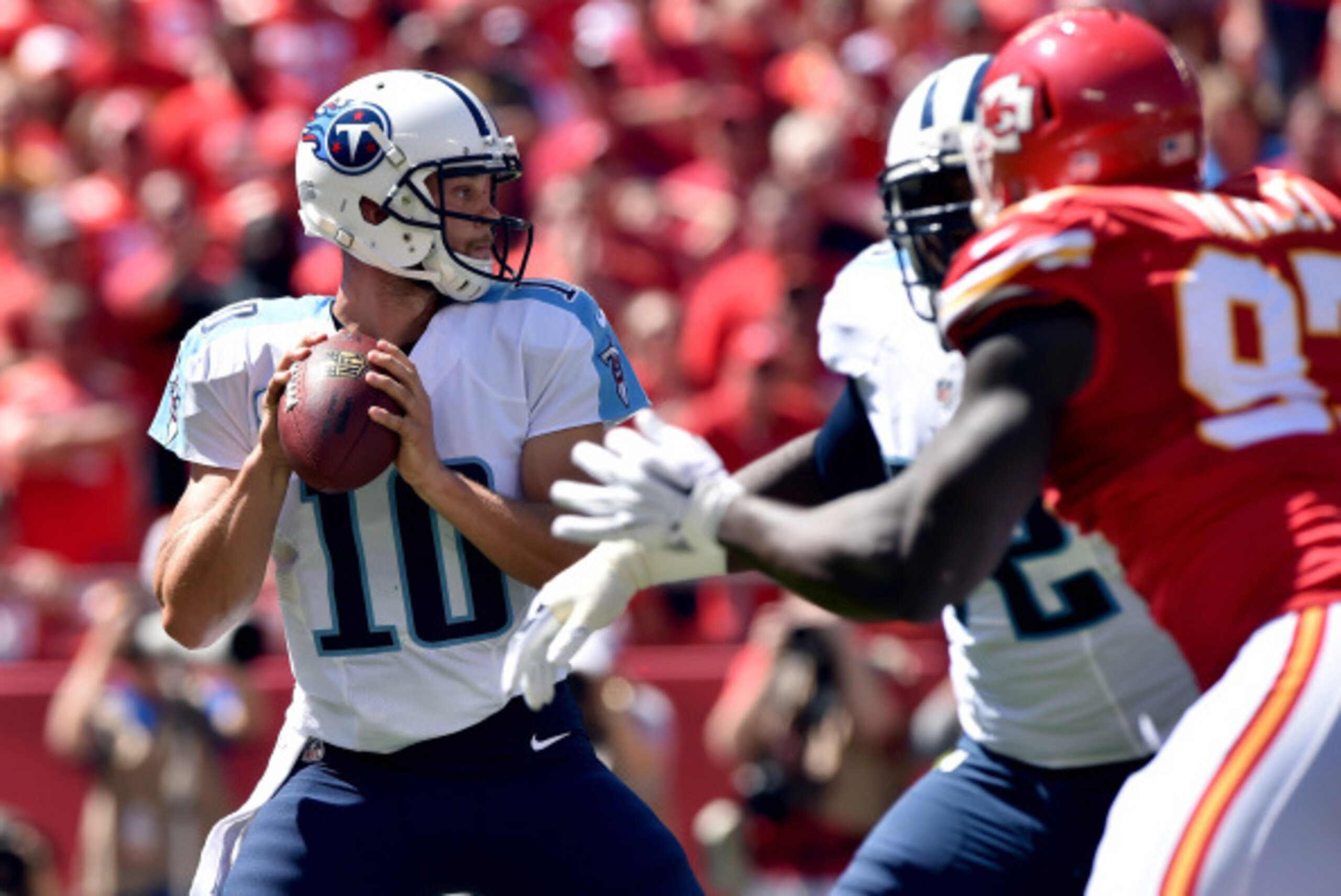 KANSAS CITY, MO - SEPTEMBER 07: Jake Locker #10 of the Tennessee Titans drops back to pass against the Kansas City Chiefs during the first half at Arrowhead Stadium on September 7, 2014 in Kansas City, Missouri.  (Photo by Peter Aiken/Getty Images)