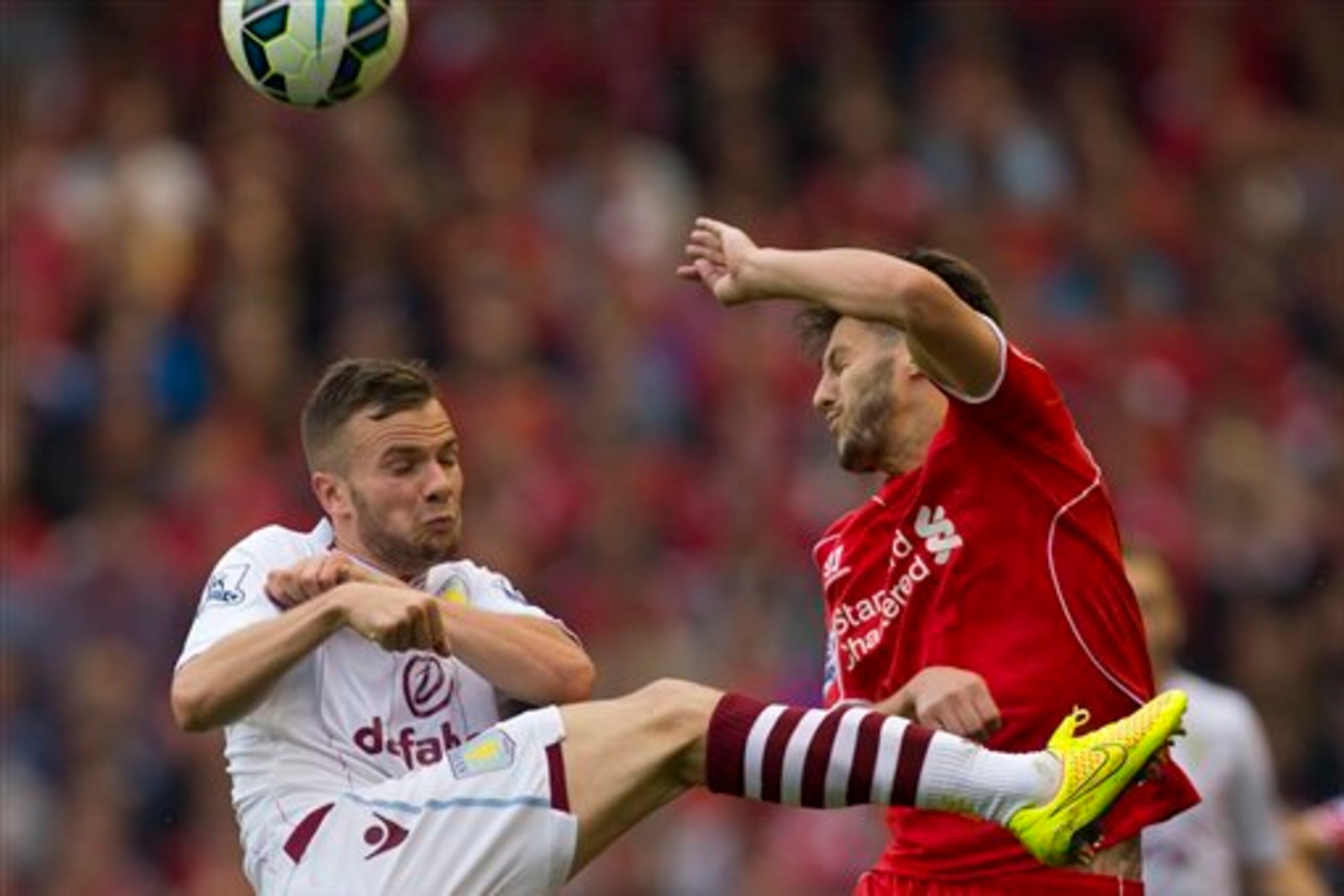 Cleverley and Lallana battle for the ball