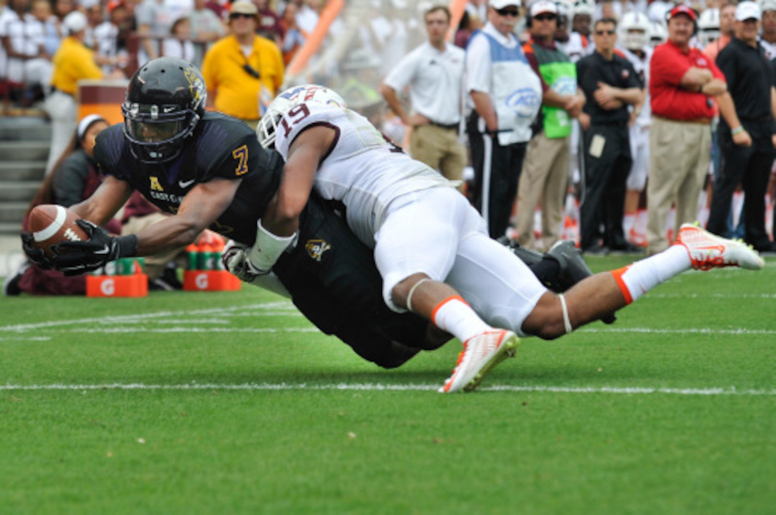 BLACKSBURG, VA - SEPTEMBER 13:  Wide receiver Isaiah Jones #7 of the East Carolina Pirates stretches across the goal line to score a touchdown against Virginia Tech in the first half at Lane Stadium on September 13, 2014 in Blacksburg, Virginia. East Caro