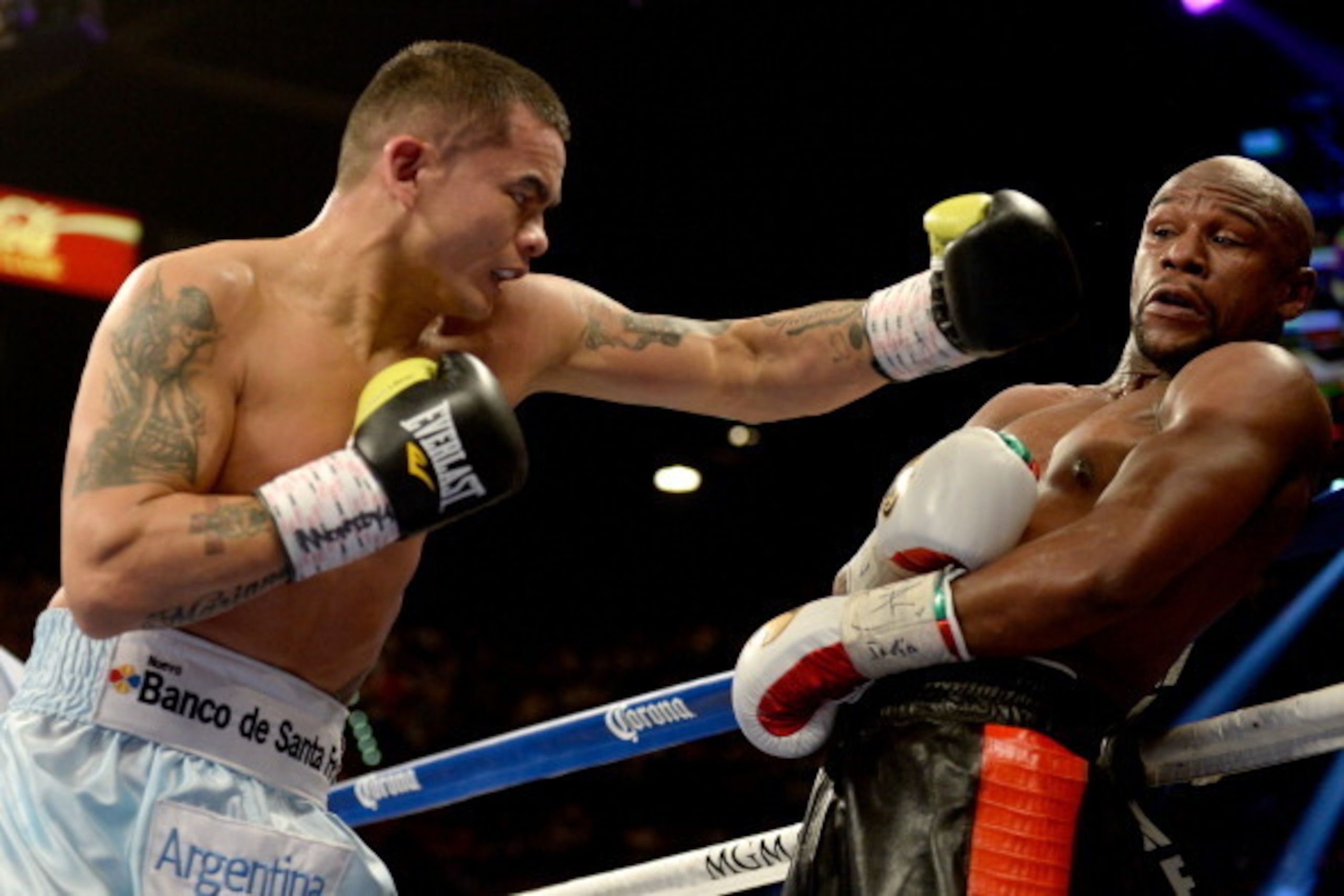 LAS VEGAS, NV - MAY 03: (L-R) Marcos Maidana throws a left at Floyd Mayweather Jr. during their WBC/WBA welterweight unification fight at the MGM Grand Garden Arena on May 3, 2014 in Las Vegas, Nevada. (Photo by Harry How/Getty Images) LAS VEGAS, NV - MAY 03: (L-R) Marcos Maidana throws a left at Floyd Mayweather Jr. during their WBC/WBA welterweight unification fight at the MGM Grand Garden Arena on May 3, 2014 in Las Vegas, Nevada. (Photo by Harry How/Getty Images)