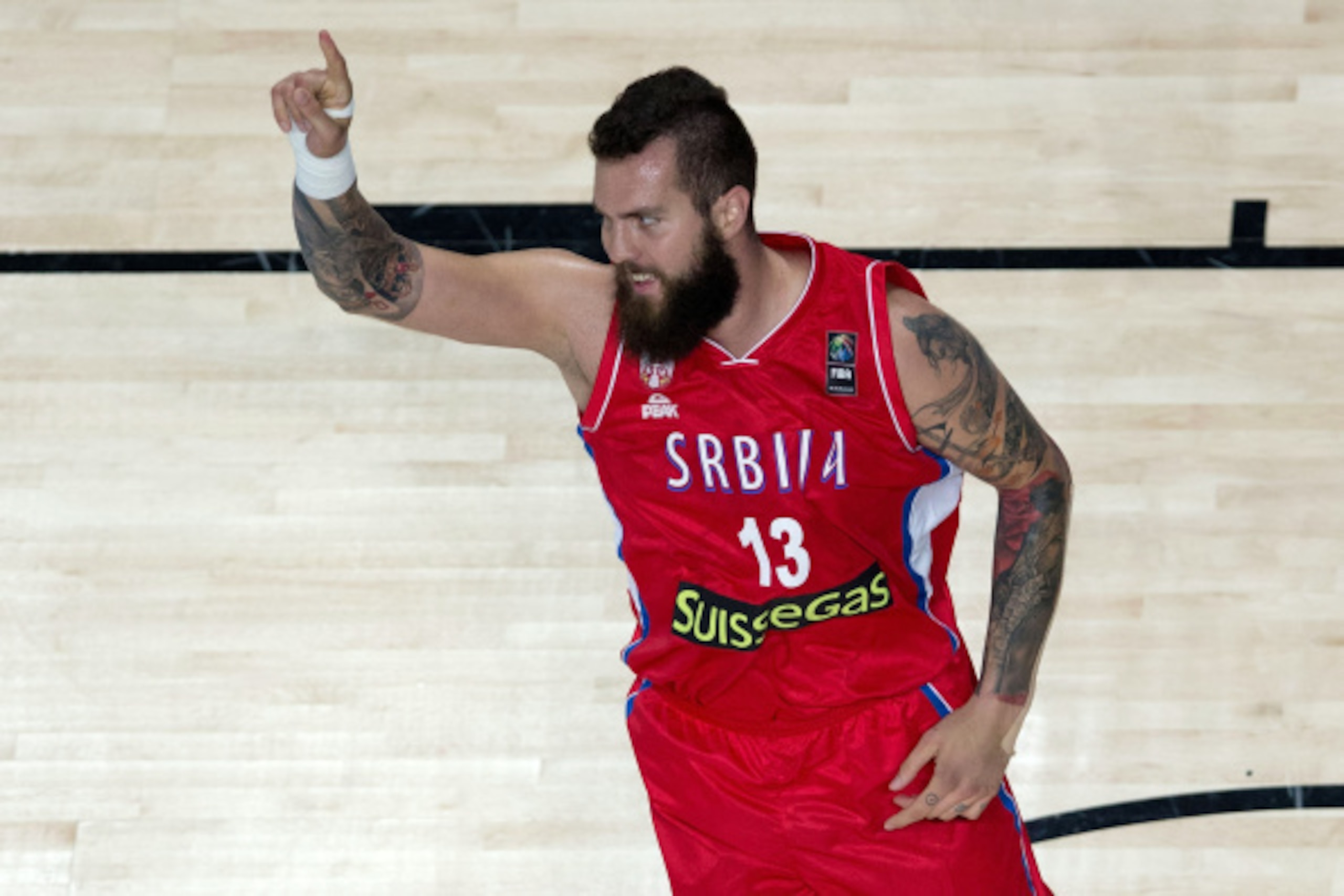 MADRID, SPAIN - SEPTEMBER 12: Miroslav Raduljica of Serbia celebrates scoring during the 2014 FIBA World Basketball Championship semifinal match between France and Serbia at Palacio de los Deportes on September 12, 2014 in Madrid, Spain.  (Photo by Gonzal