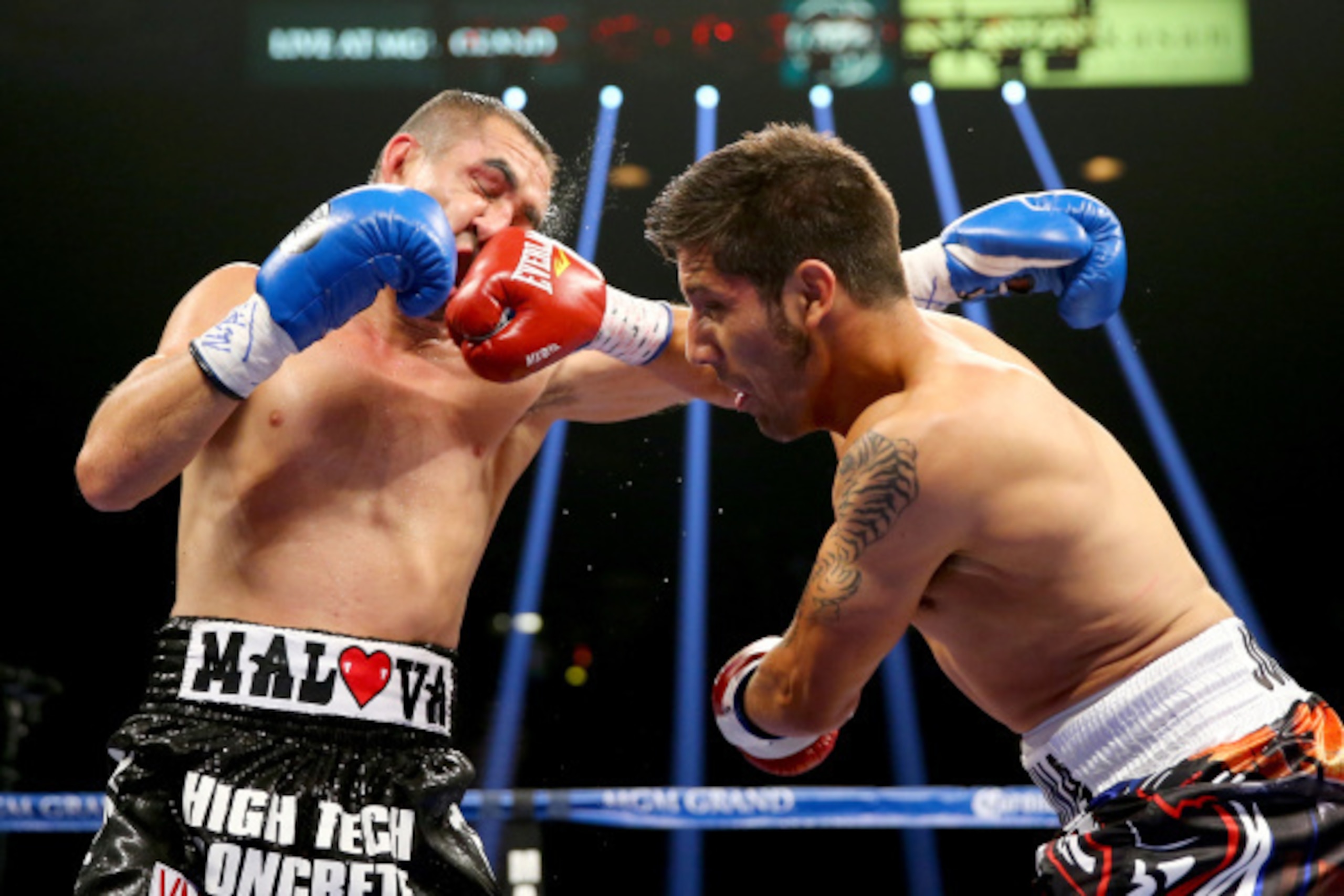 LAS VEGAS, NV - SEPTEMBER 13:  (R-L) John Molina Jr. connects with a right to the face of Humberto Soto during their junior welterweight fight at the MGM Grand Garden Arena on September 13, 2014 in Las Vegas, Nevada.  (Photo by Al Bello/Getty Images)