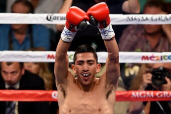 LAS VEGAS, NV - SEPTEMBER 13:  Leo Santa Cruz celebrates after a second round TKO of Manuel Roman during their WBC super bantamweight title fight at the MGM Grand Garden Arena on September 13, 2014 in Las Vegas, Nevada.  (Photo by Ethan Miller/Getty Image