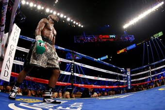 LAS VEGAS, NV - SEPTEMBER 13:  Floyd Mayweather Jr. looks on while taking on Marcos Maidana during their WBC/WBA welterweight title fight at the MGM Grand Garden Arena on September 13, 2014 in Las Vegas, Nevada.  (Photo by Al Bello/Getty Images)