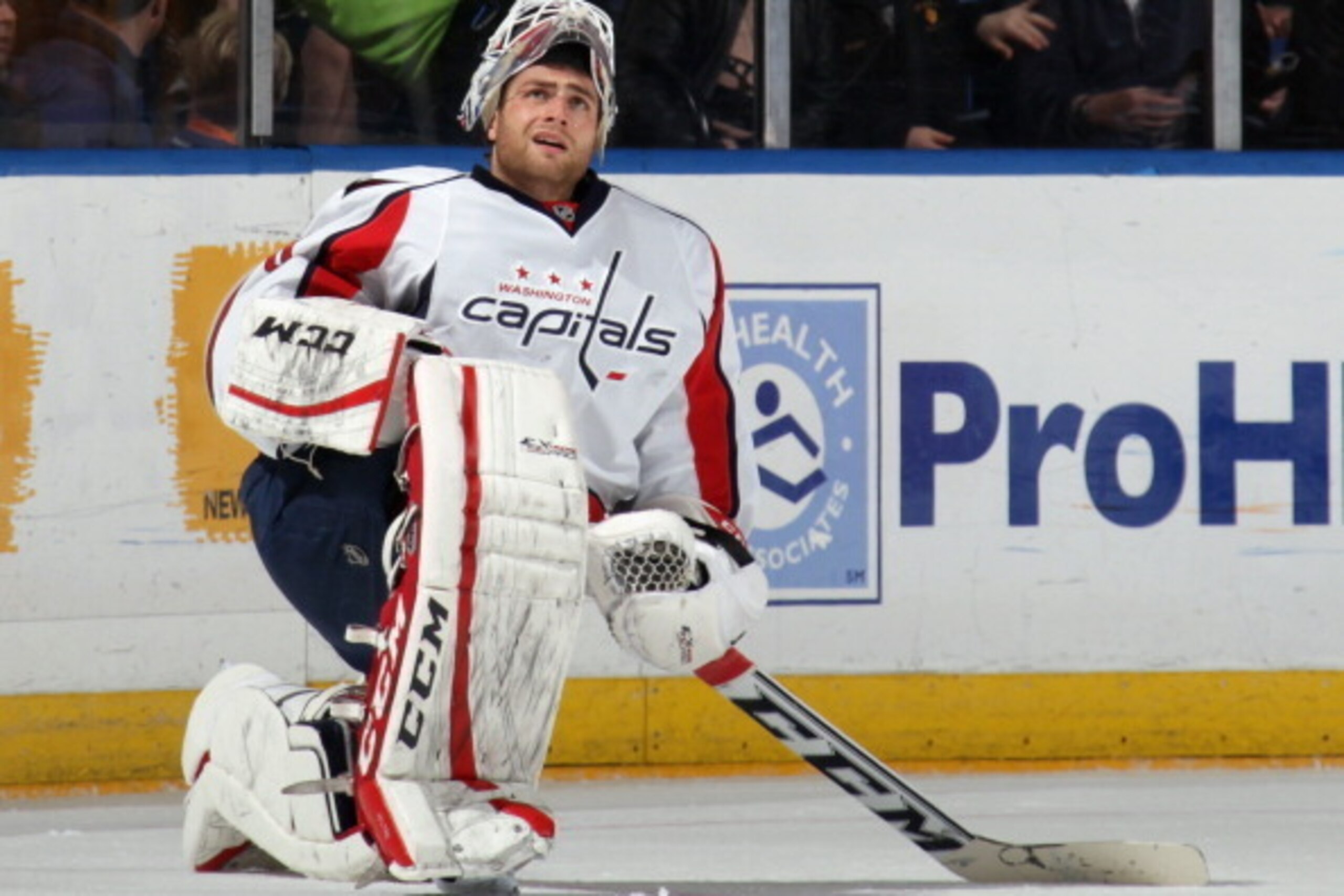 UNIONDALE, NY - APRIL 05: Braden Holtby #70 of the Washington Capitals pauses to watch a replay on the scoreboard during the first period against the New York Islanders at the Nassau Veterans Memorial Coliseum on April 5, 2014 in Uniondale, New York.  (Ph