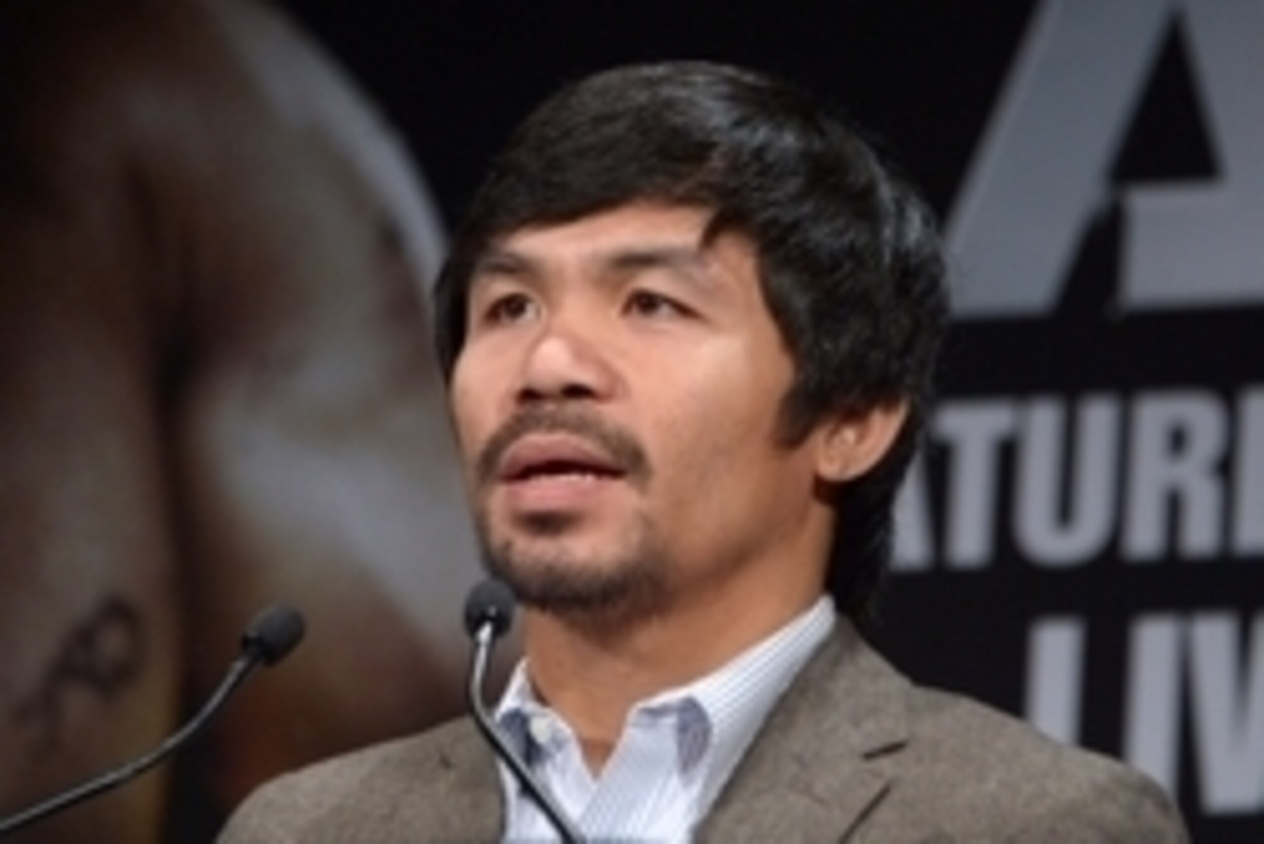 Sep 3, 2014; Los Angeles, CA, USA; Manny Pacquiao poses at press conference at Hyatt Regency Century Plaza Hotel in advance of World Welterweight Championship bout against Chris Algieri (not pictured) on Nov. 22, 2014. Mandatory Credit: Kirby Lee-USA TODA