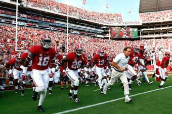 TUSCALOOSA, AL - SEPTEMBER 13:  Head coach Nick Saban of the Alabama Crimson Tide leads his team on the field to face the Southern Miss Golden Eagles at Bryant-Denny Stadium on September 13, 2014 in Tuscaloosa, Alabama.  (Photo by Kevin C. Cox/Getty Image