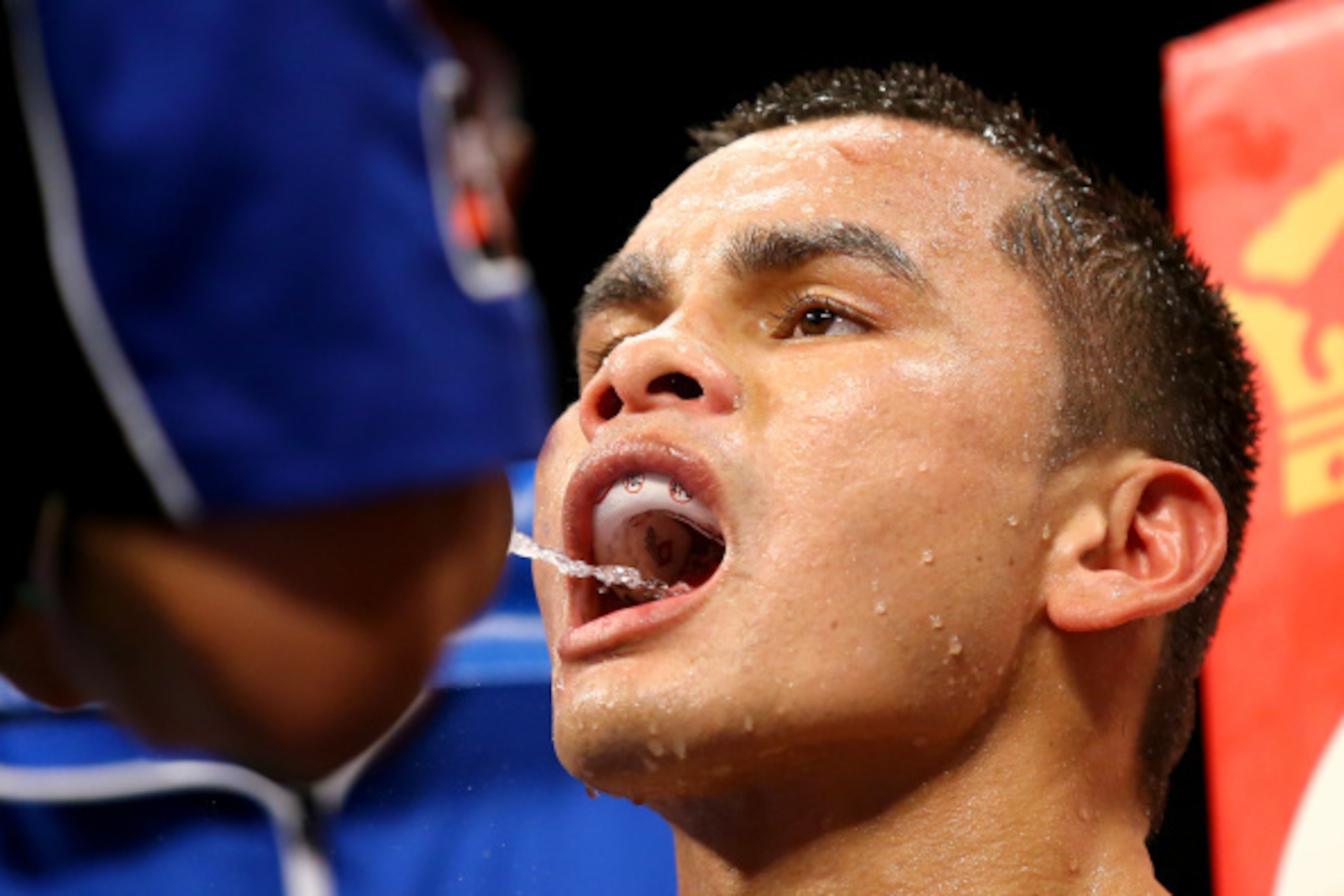 LAS VEGAS, NV - SEPTEMBER 13:  Marcos Maidana drinks water in his corner while taking on Floyd Mayweather Jr. during their WBC/WBA welterweight title fight at the MGM Grand Garden Arena on September 13, 2014 in Las Vegas, Nevada.  (Photo by Al Bello/Getty