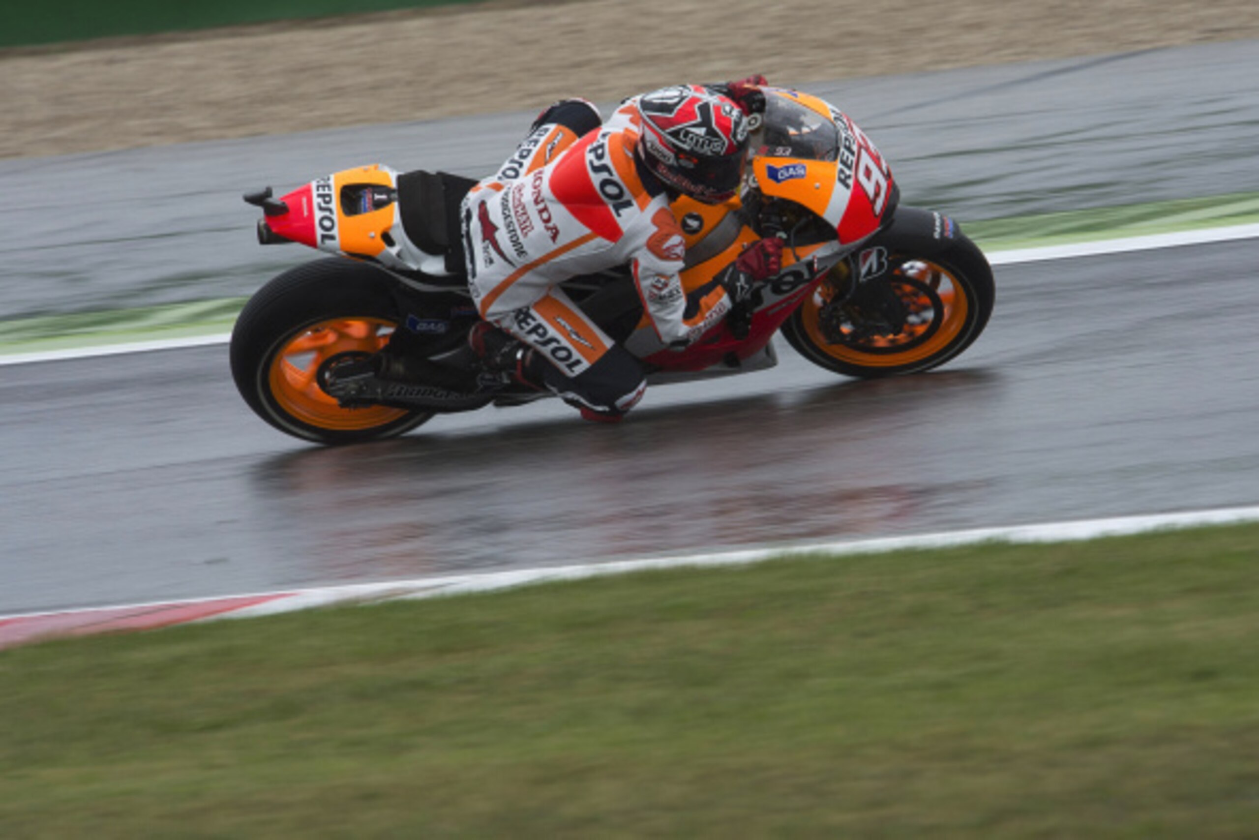 MISANO ADRIATICO, ITALY - SEPTEMBER 12:   Marc Marquez of Spain and Repsol Honda Team rounds the bend during the MotoGP of San Marino - Free Practice at Misano World Circuit on September 12, 2014 in Misano Adriatico, Italy.  (Photo by Mirco Lazzari gp/Get
